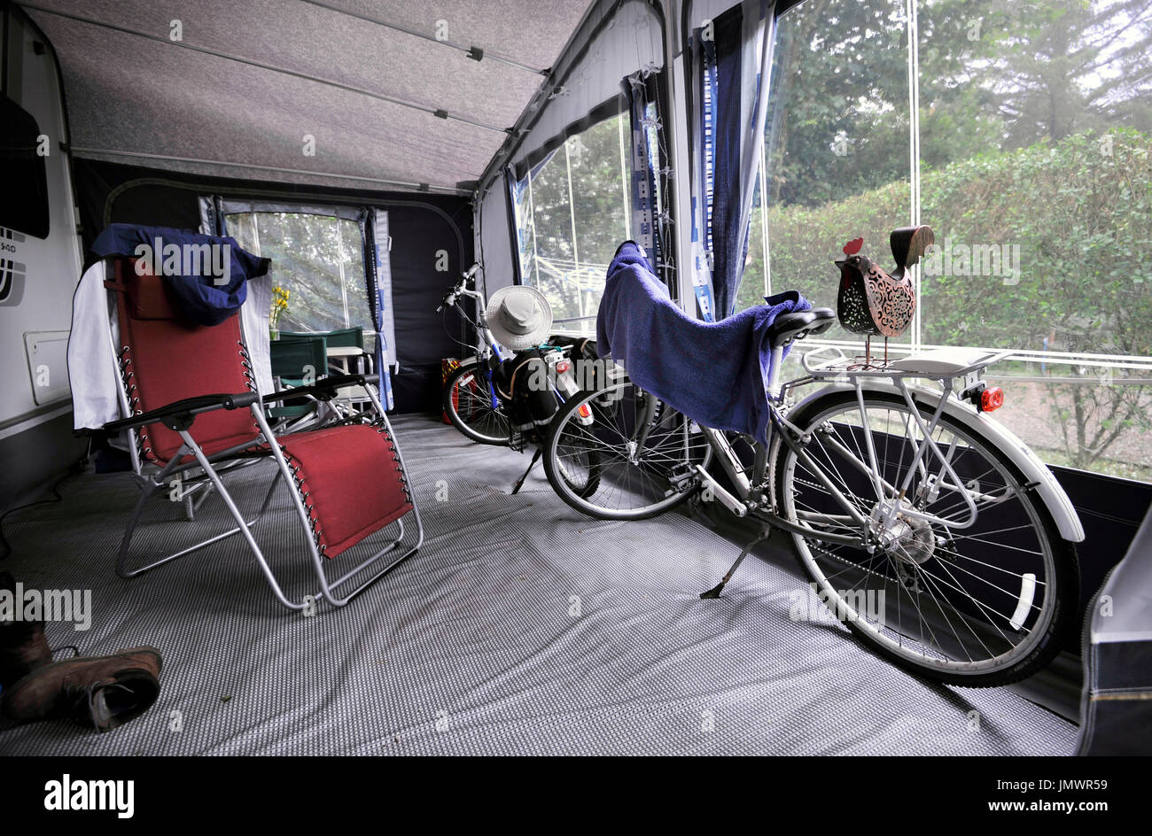 bikes stored inside caravan awning Stock Photo