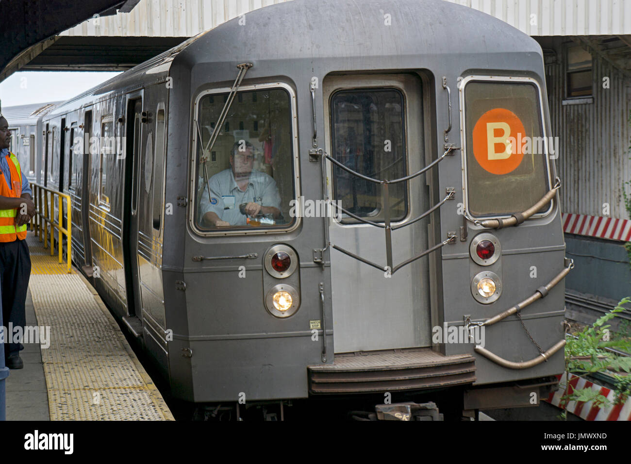 A B subway train pulling into the Brighton Beach station in Brooklyn, New York. Stock Photo