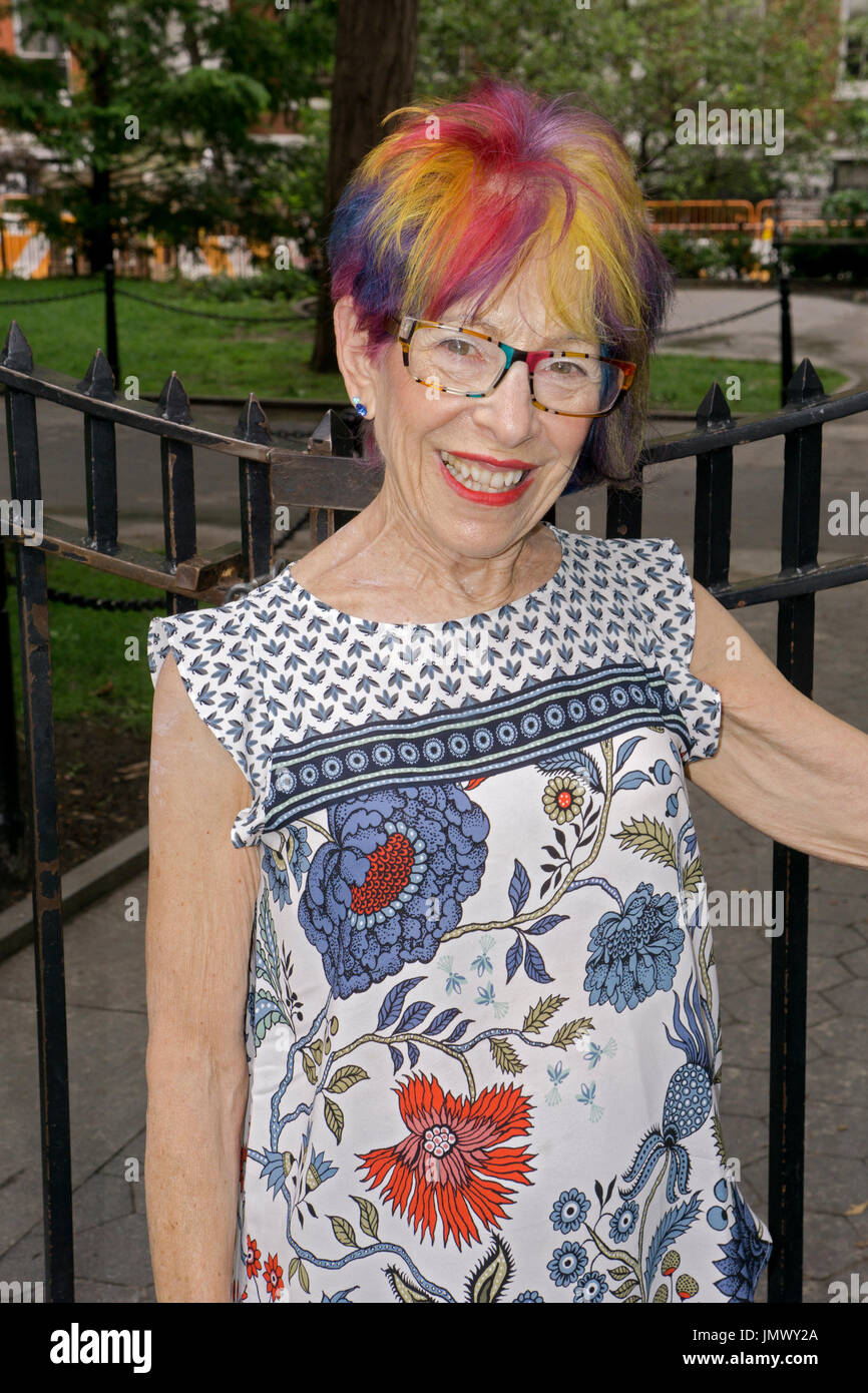 Portrait of an attractive youthful woman in her mid seventies with a modern multicolored hairdo. In Greenwich Village, New York City. Stock Photo