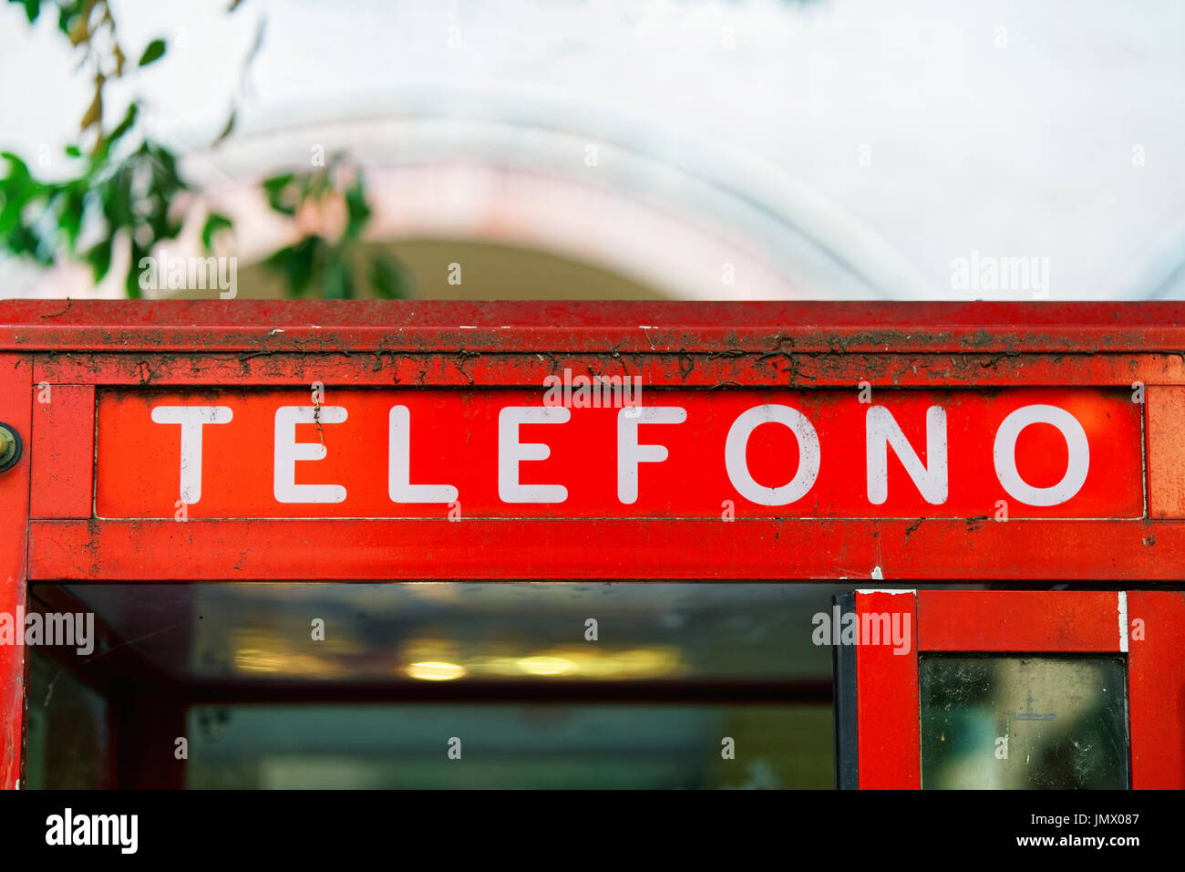 Fragment of red telephone box in Bologna, Italy Stock Photo