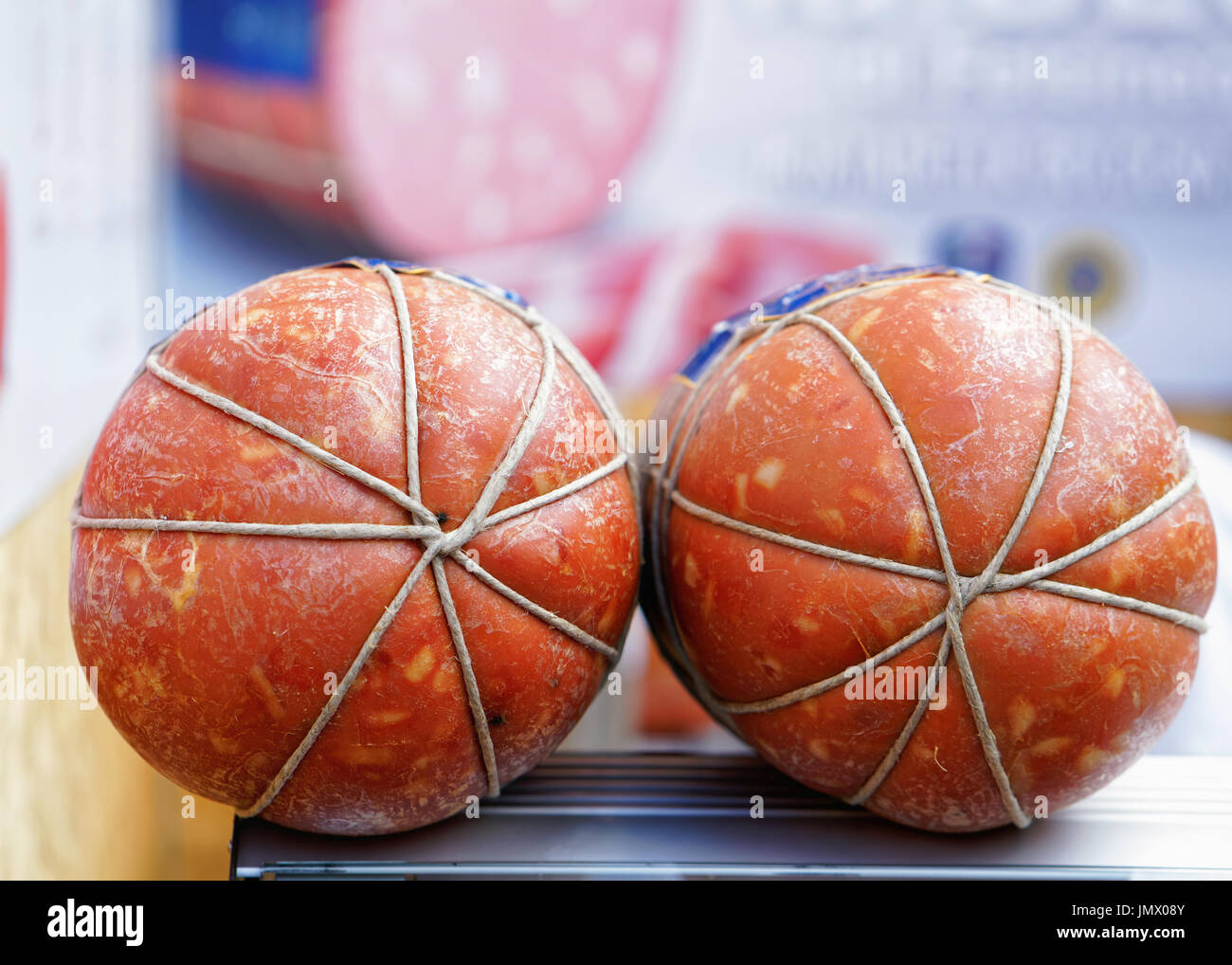 Italian traditional Bologna sausage at the stall on the market in