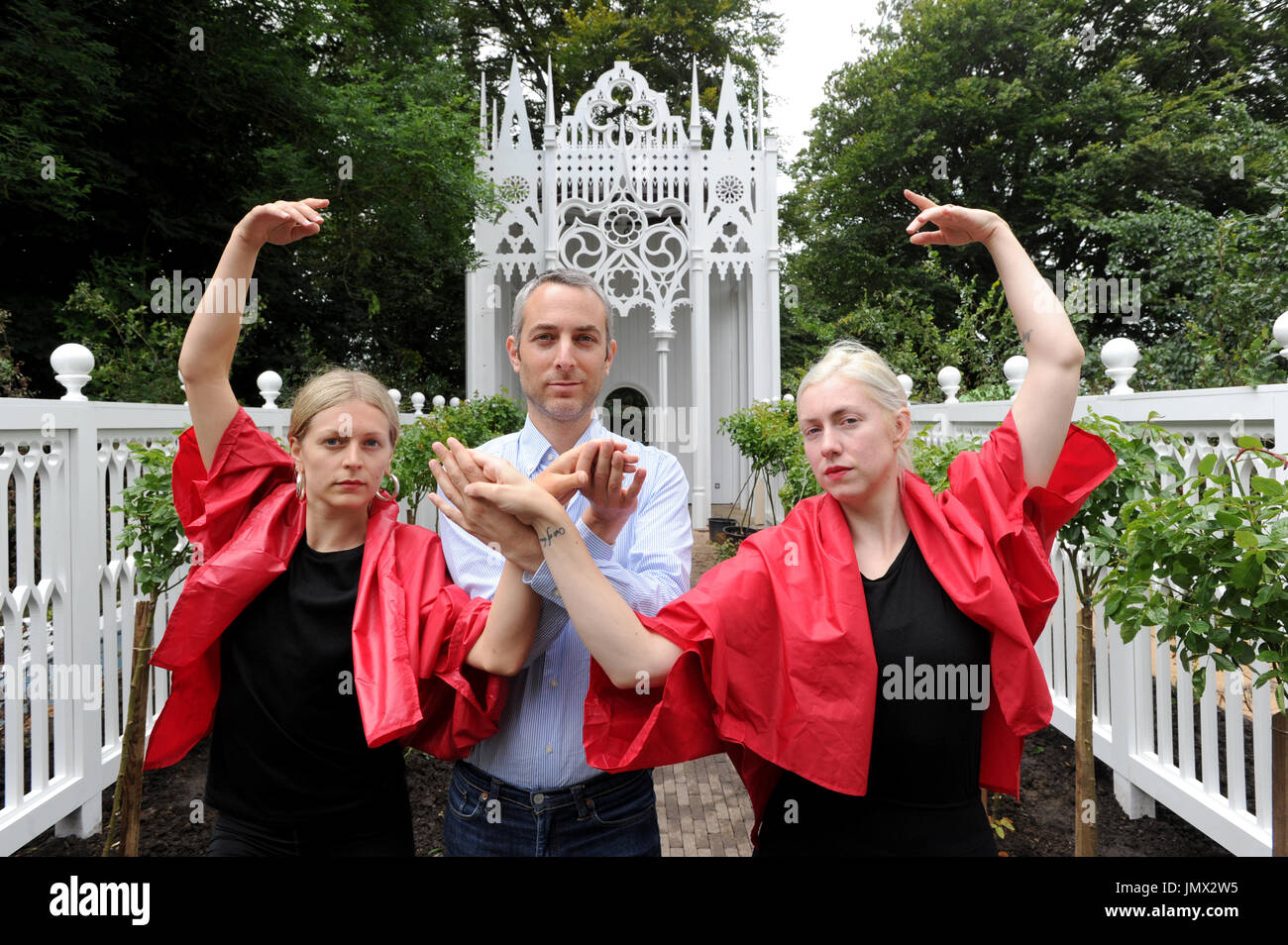 A rehearsal of Pablo Bronstein's (centre) ballet The Rose Walk is performed by classically trained dancers Rosalie Wahlfrid and Emilia Gasiorek (left) at the Jupiter Artland in West Lothian, which was commissioned for this year's Edinburgh Art Festival. Stock Photo