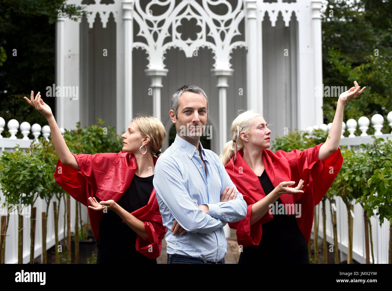 A rehearsal of Pablo Bronstein's (centre) ballet The Rose Walk is performed by classically trained dancers Rosalie Wahlfrid and Emilia Gasiorek (left) at the Jupiter Artland in West Lothian, which was commissioned for this year's Edinburgh Art Festival. Stock Photo