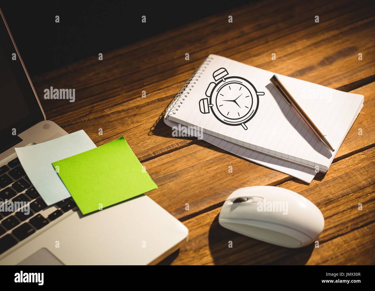 Digital composite of Clock drawing of time on notepad with laptop Stock ...
