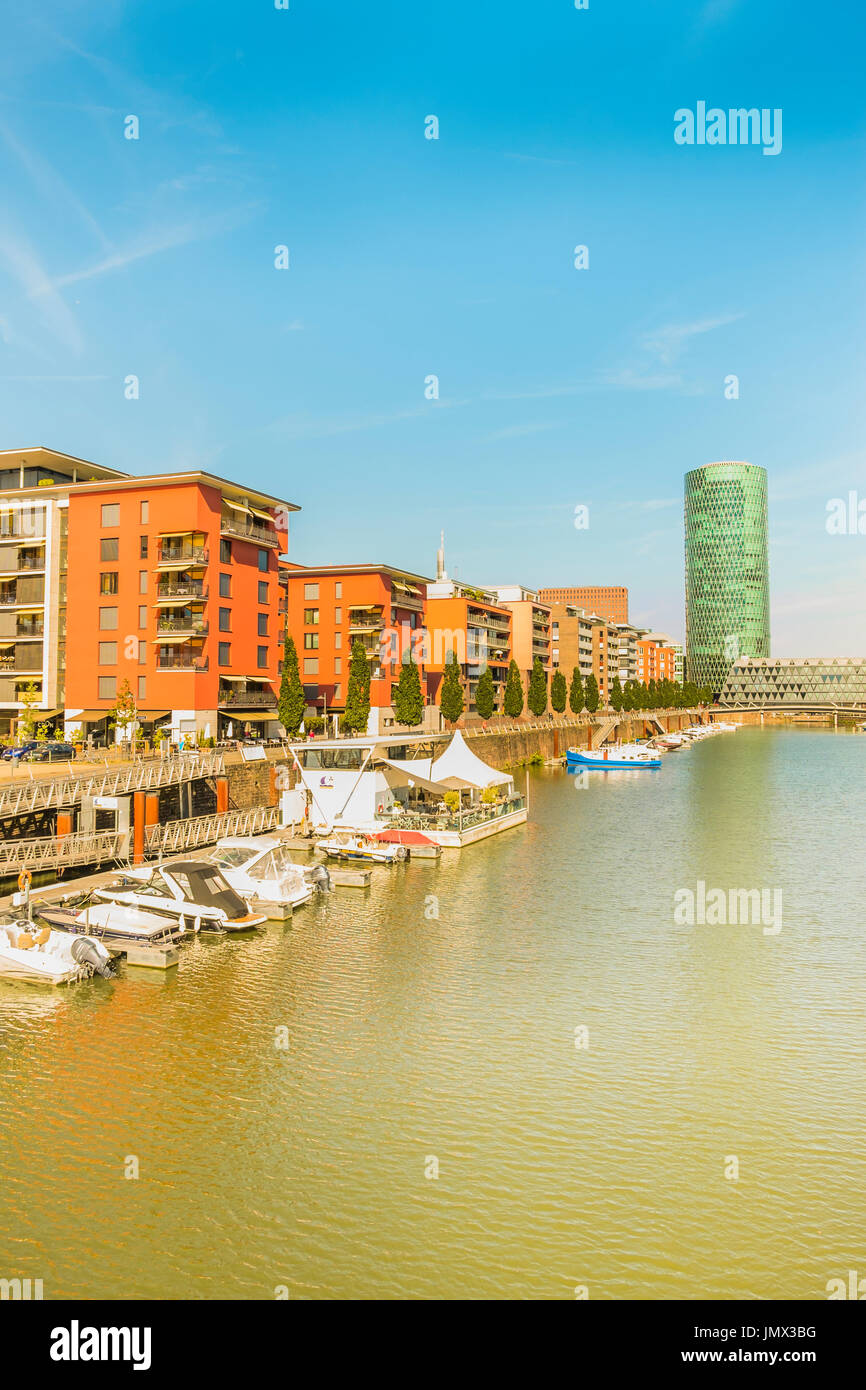 new westhafen residential buildings with westhafen tower in background, moorings and pleasure boats, frankfurt am main, hesse, germany Stock Photo