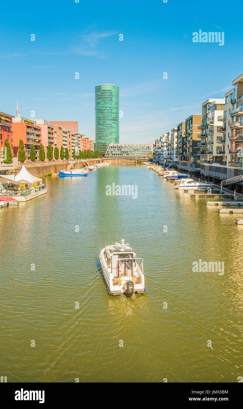 new westhafen residential buildings with westhafen tower in background, moorings and pleasure boats, frankfurt am main, hesse, germany Stock Photo