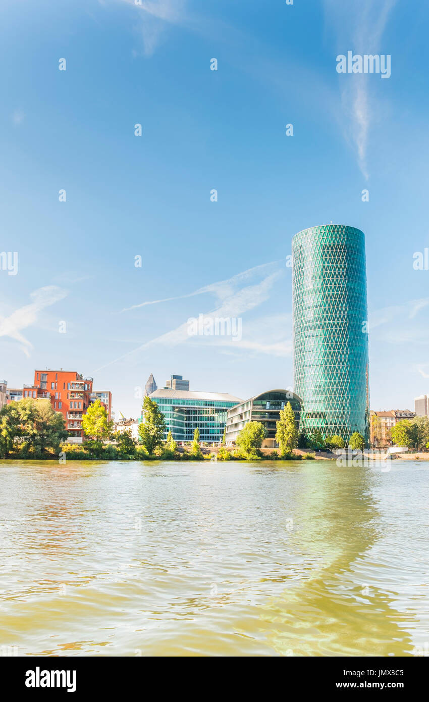 westhafen-tower and residential buildings seen from the south banks of river main, frankfurt am main, hesse, germany Stock Photo
