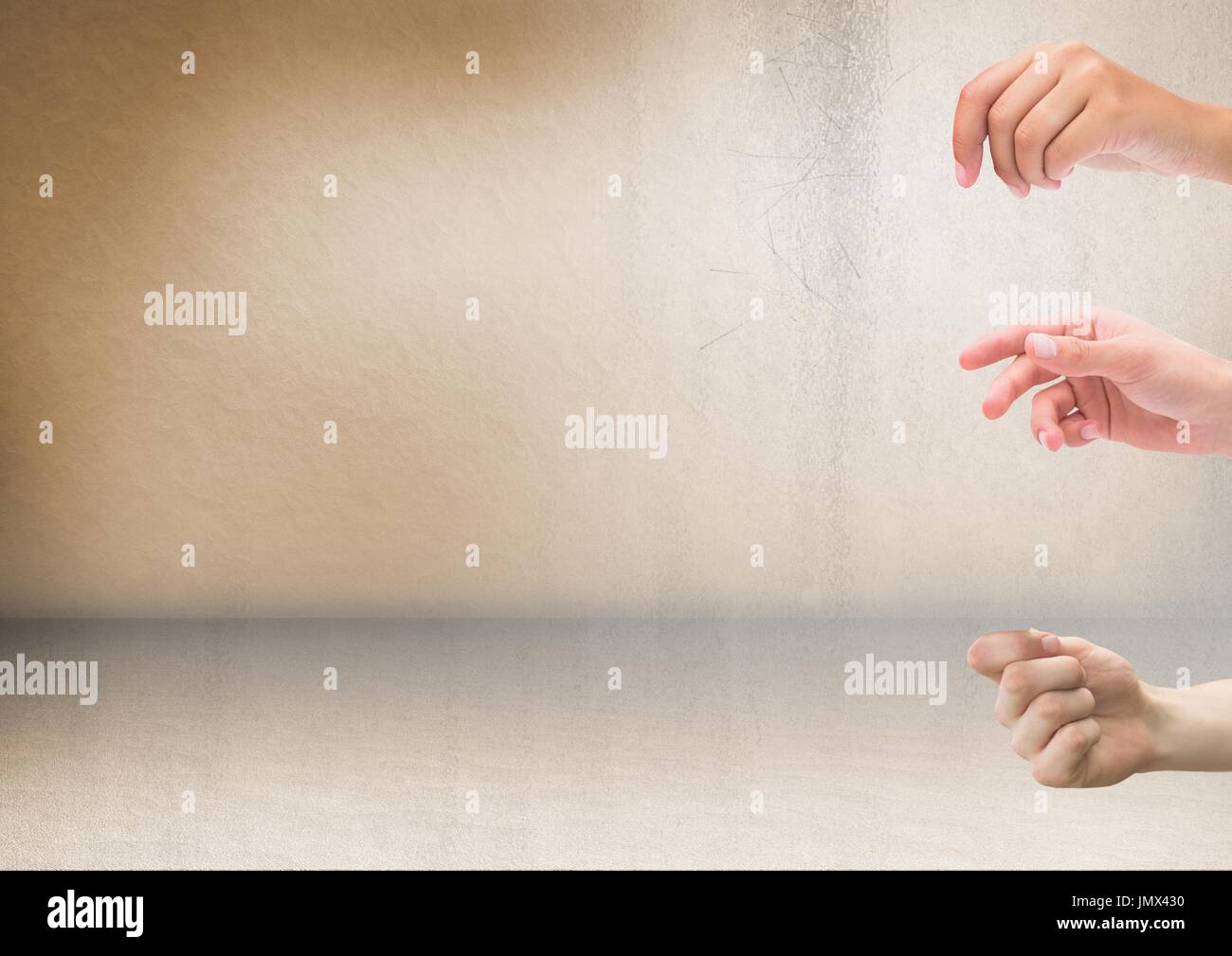 Digital composite of Three hands with rustic background Stock Photo