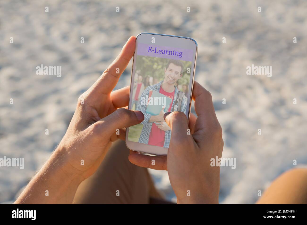 Digital composite of Person using a phone  with e-learning information in the screen Stock Photo