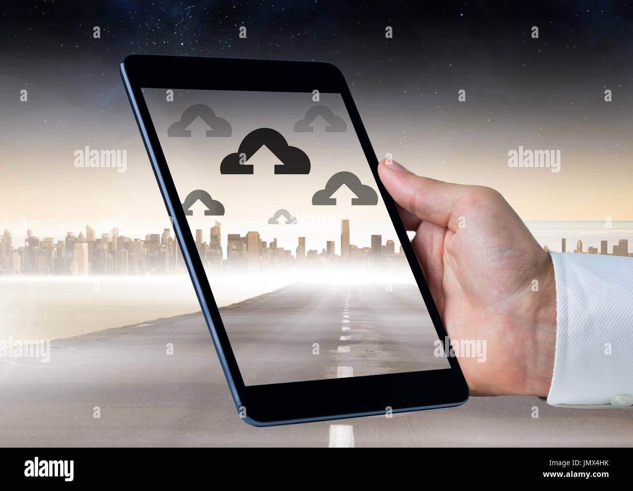 Digital composite of Holding tablet and Cloud icons over city Stock ...
