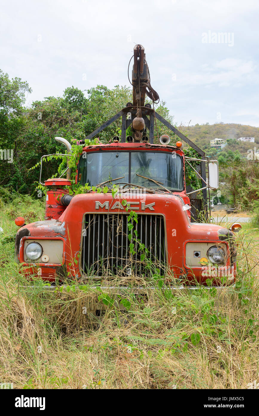 environmental pollution, Disposed red old truck, Tortola Island, British Virgin Islands, Caribbean Stock Photo