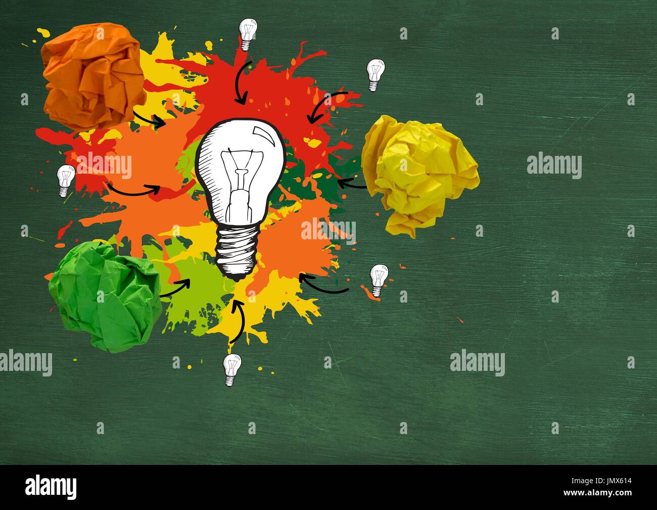 Digital composite of light bulb with colorful crumpled paper balls in ...