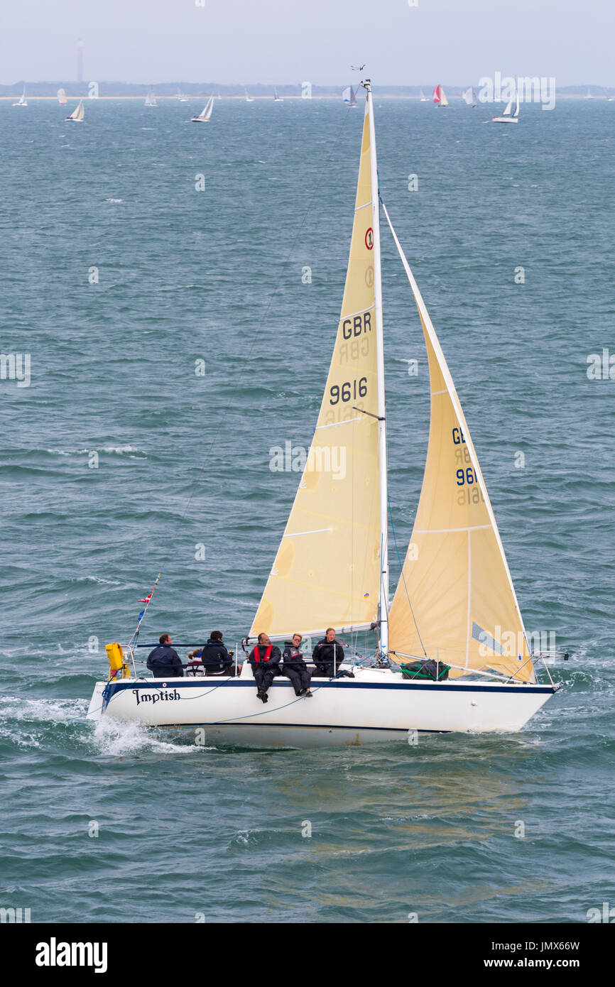 Yacht sailing in the Solent between Lymington and Yarmouth, Isle of Wight, Hampshire, UK in July - Hunter Impala 28 OOD Stock Photo