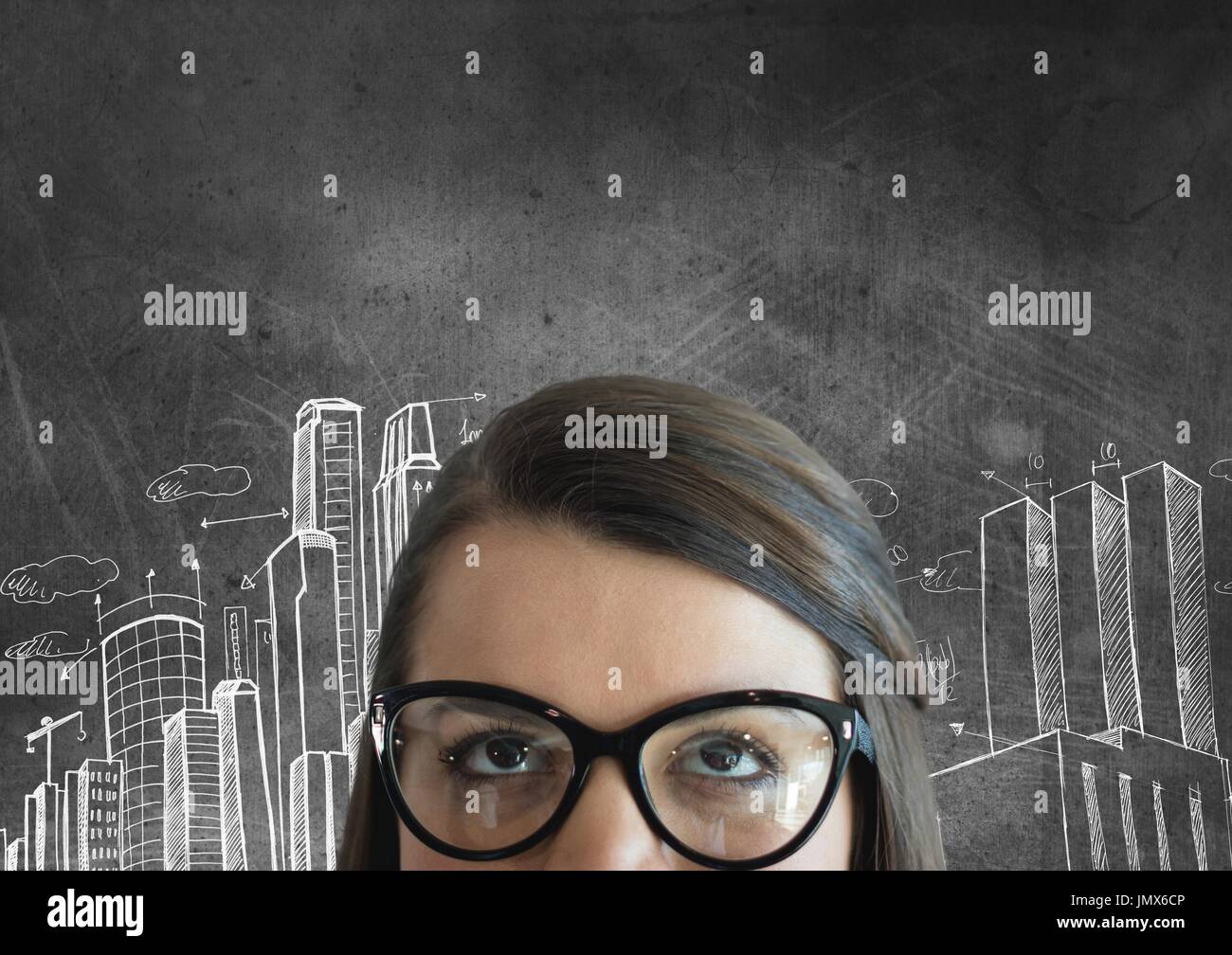 Digital composite of Business woman looking up against grey background with city icons Stock Photo
