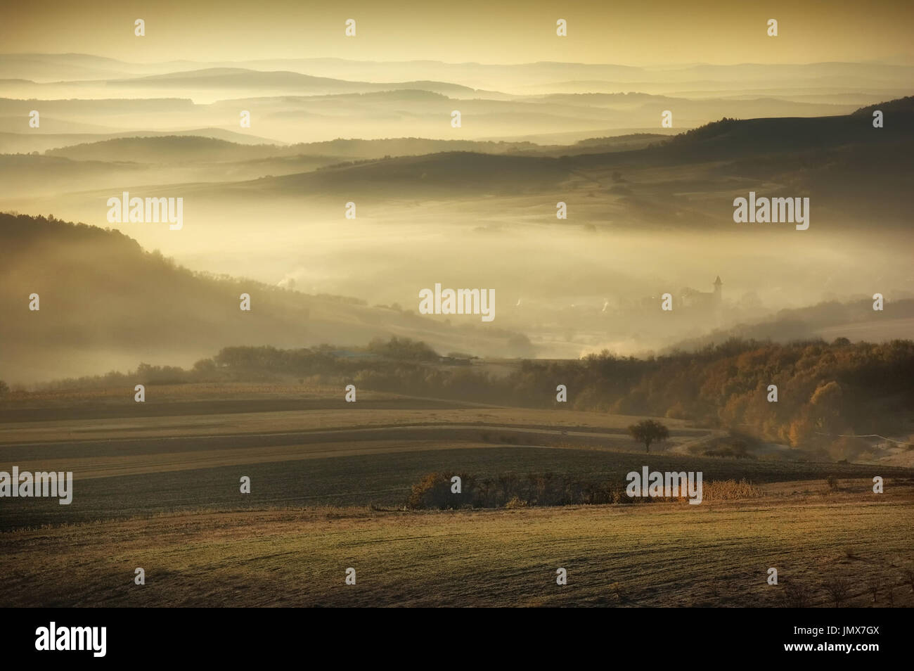 autumn morning landscape, hills in fog in rural area in eastern europe Stock Photo