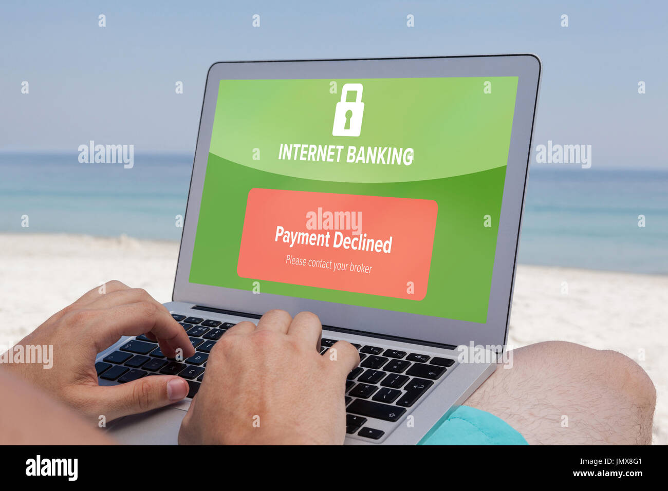 Internet banking text on green display against man using laptop while ...