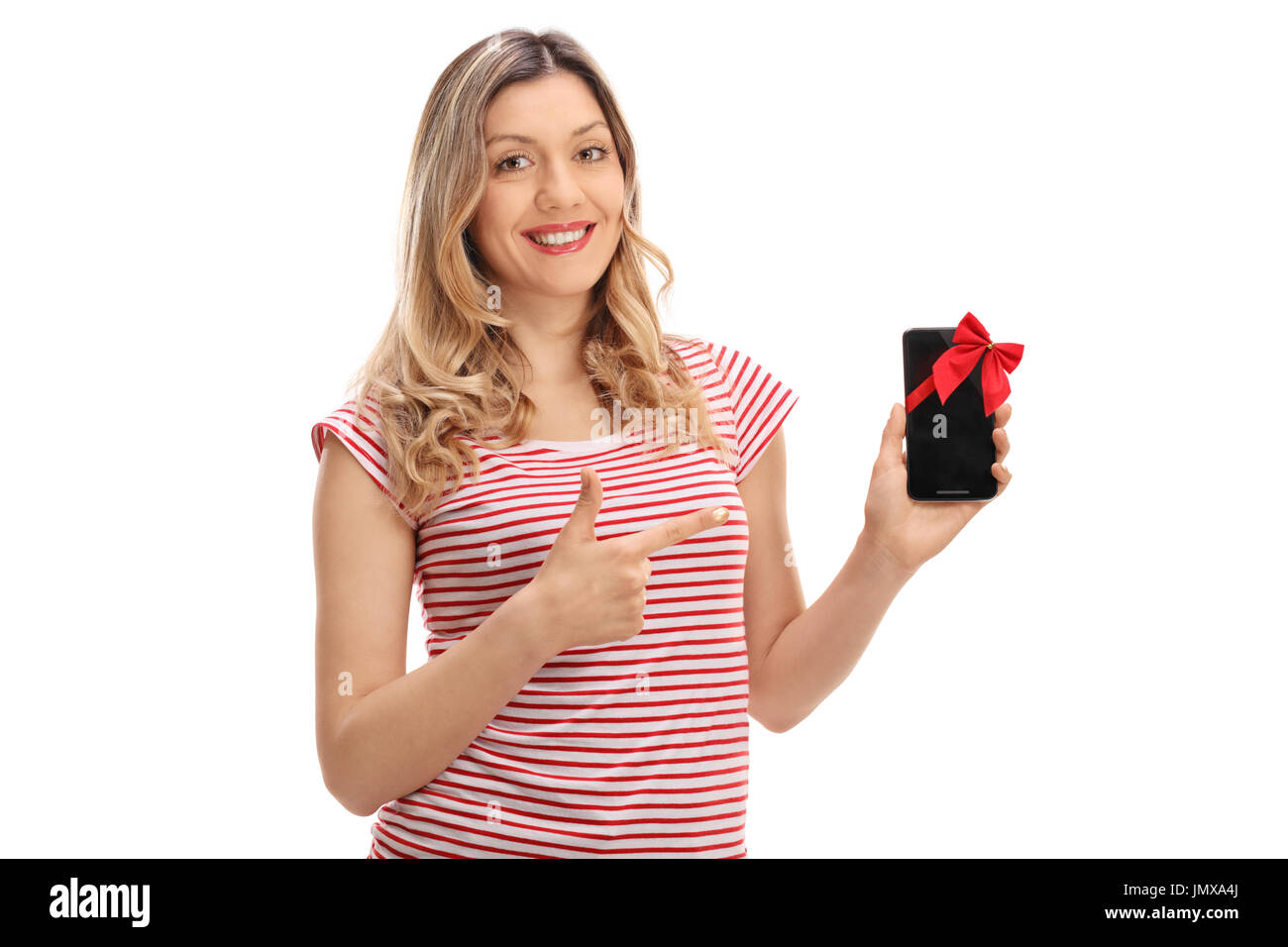 Young woman showing a phone with a red ribbon and pointing isolated on white background Stock Photo