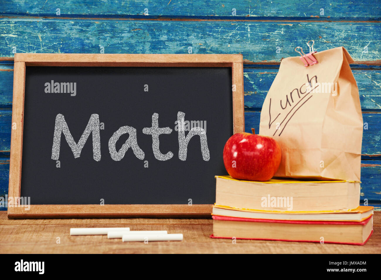 Math text on white background against blank blackboard with packed ...
