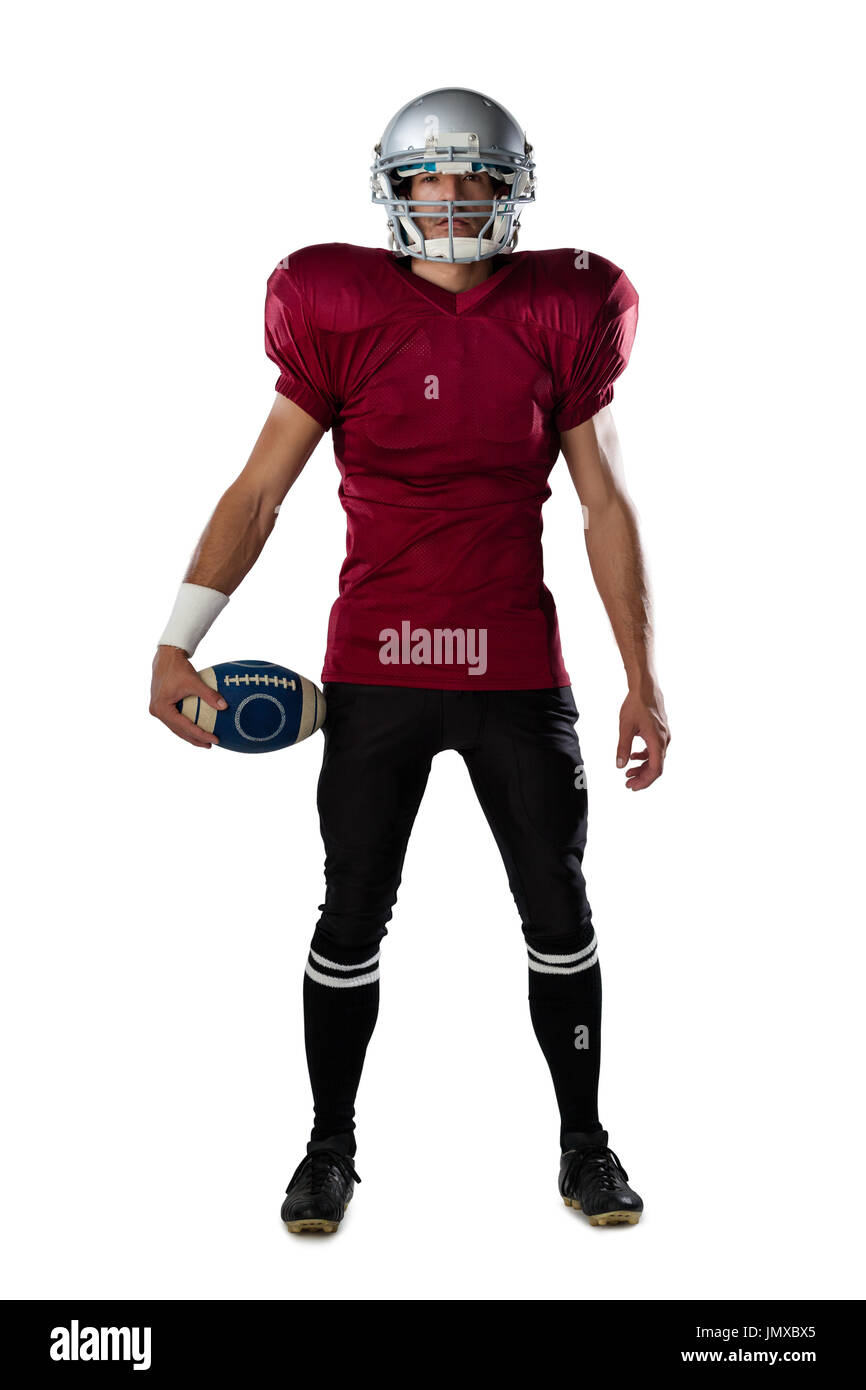 Full length of determined American football player wearing helmet