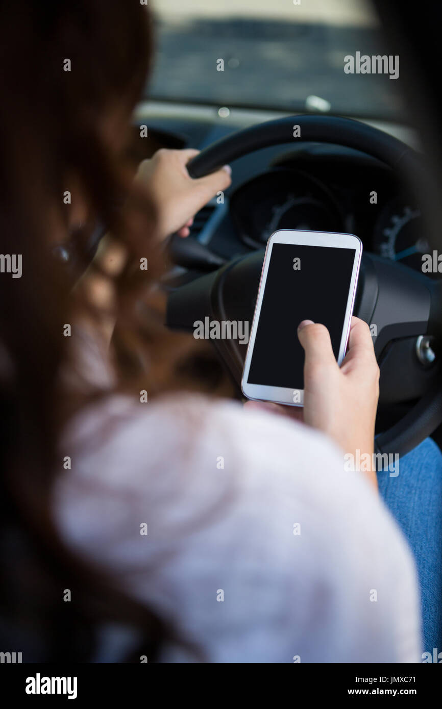 Woman and texting and rear view hi-res stock photography and images - Alamy