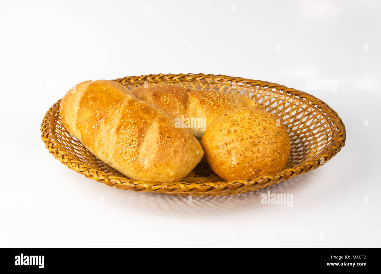 whole wheat breads and bun on a wicker plate Stock Photo - Alamy