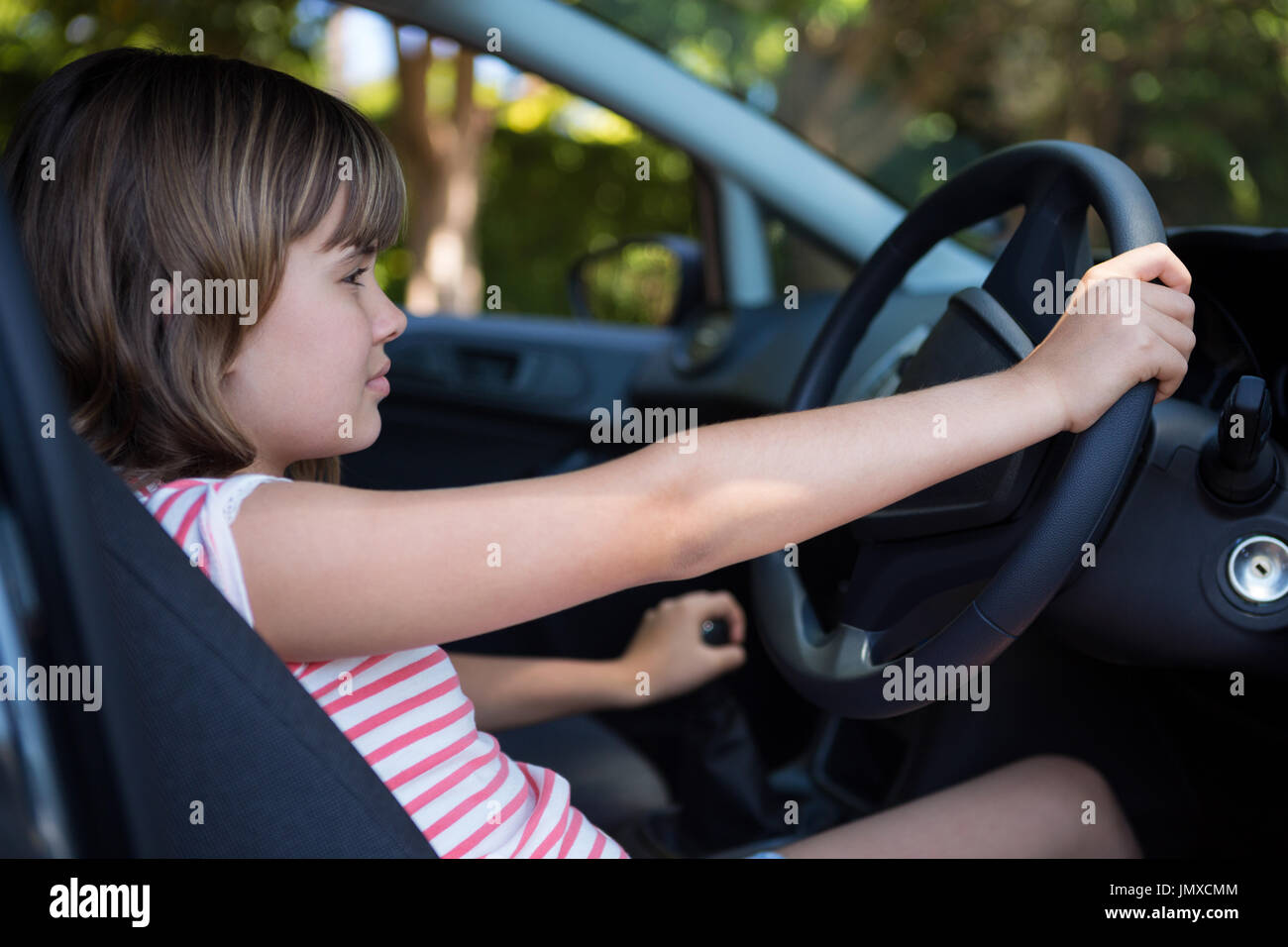 Happy teenage girl driving a car Stock Photo Alamy