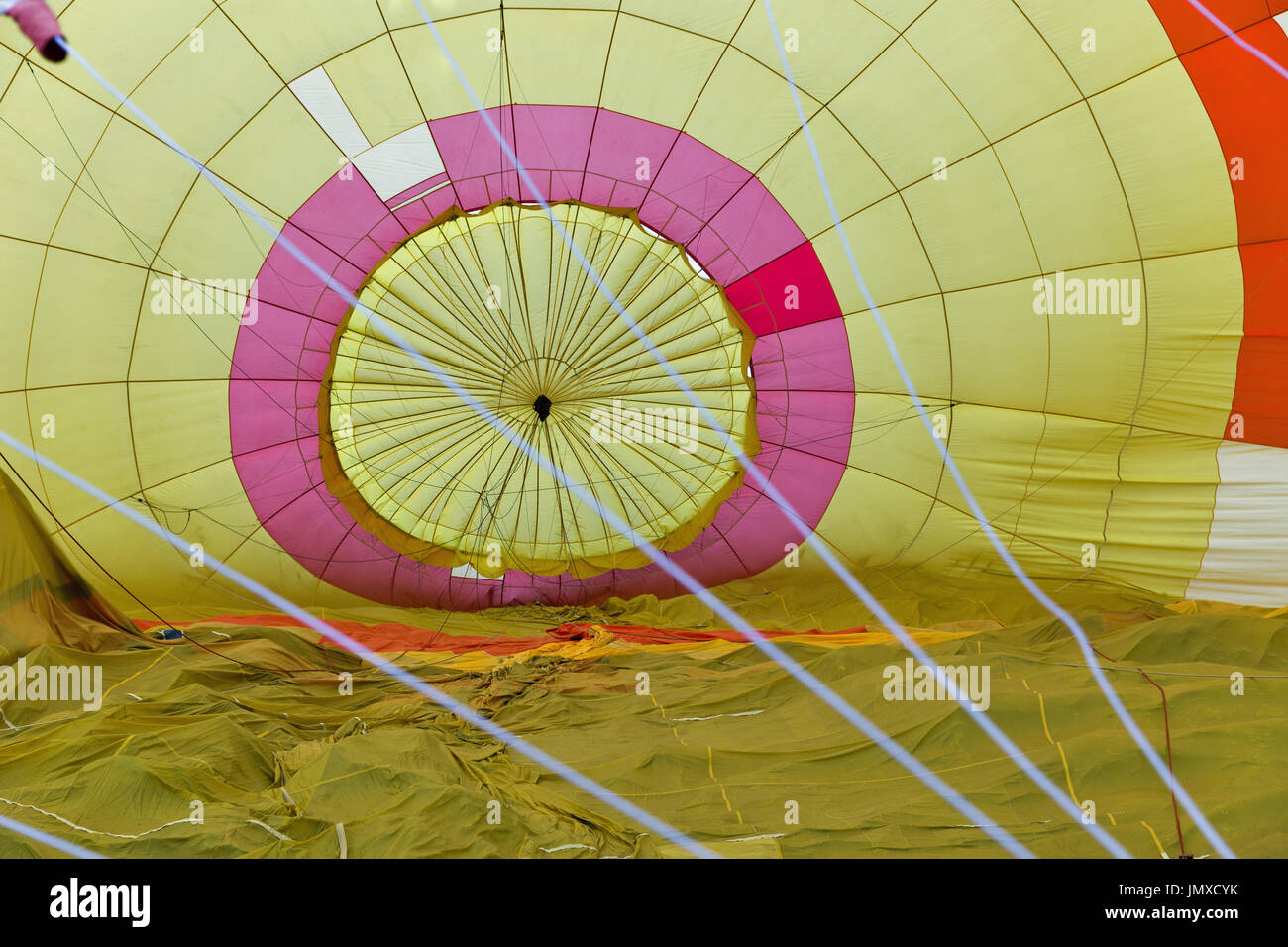 Yellow hot air balloon inside, prepairing to flight Stock Photo