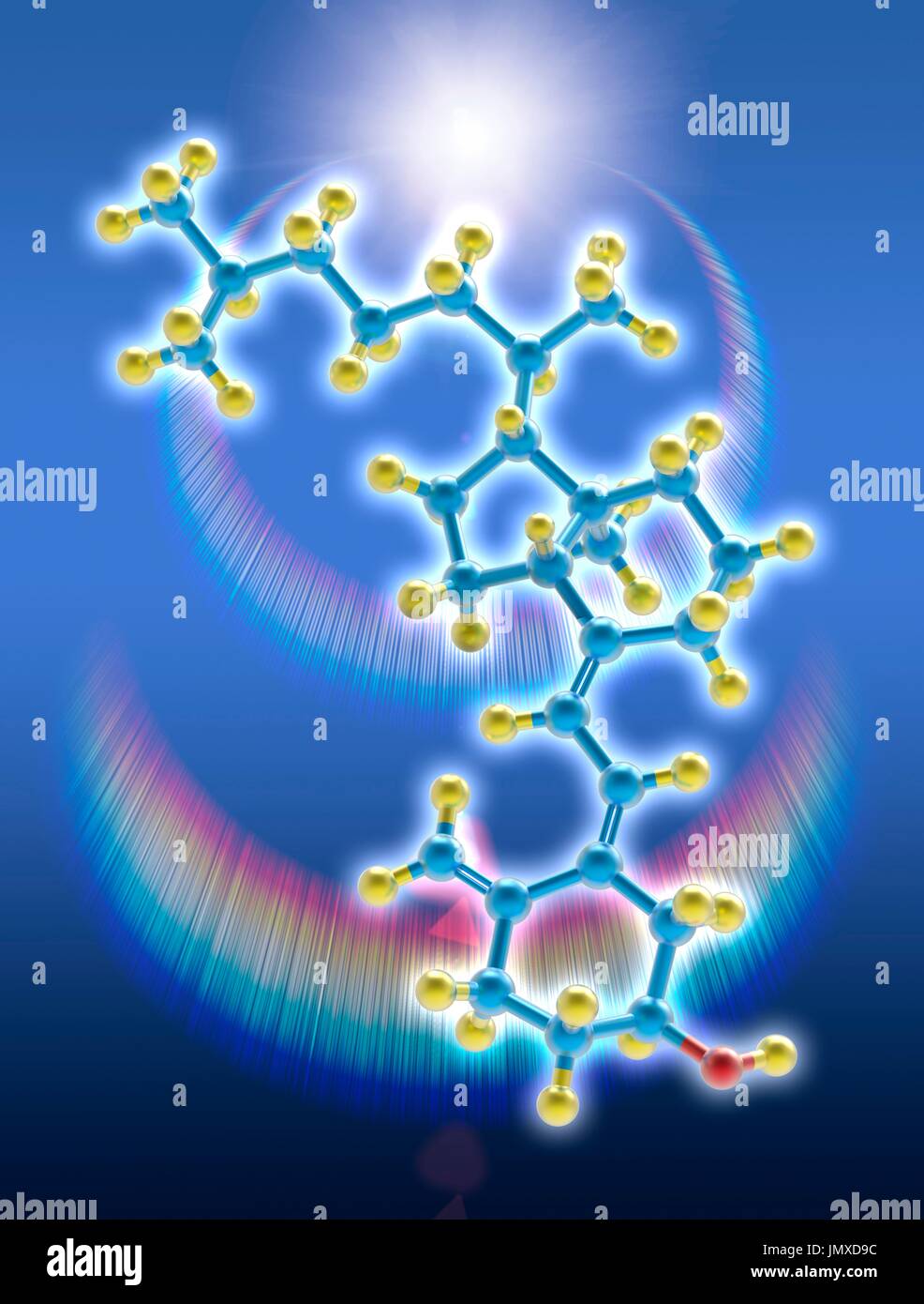 A molecular model of vitamin D3 (cholecalciferol), a form of vitamin D synthesized in the skin as a result of ultraviolet B light. Vitamin D3 plays a role in calcium absorption to maintain strong bones and balance levels of calcium and phosphorus in the blood. Atoms are coloured blue (carbon), yellow (hydrogen), and red (oxygen). In the background a sun flare with chromatic reflections. Stock Photo