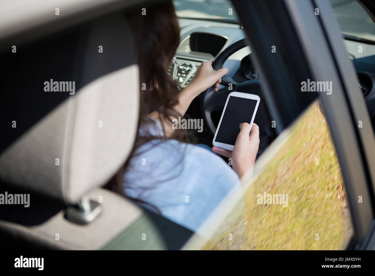 Woman and texting and rear view hi-res stock photography and images - Alamy