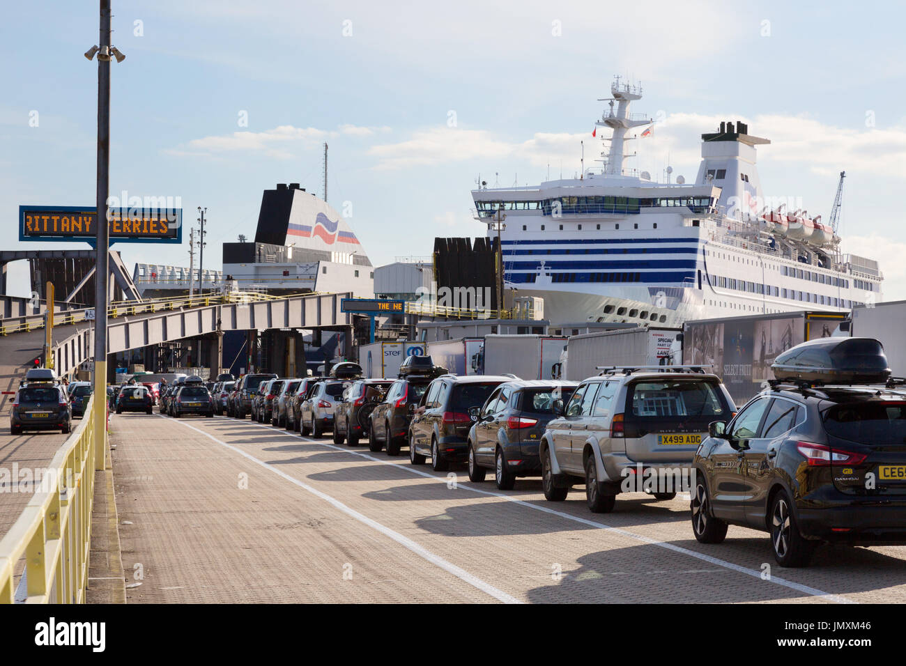 Cars waiting to board a car ferry, Portsmouth docks, Portsmouth UK Stock Photo