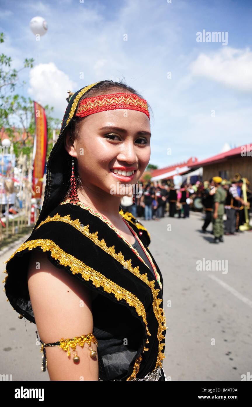 Smiling Kadazan Dusun girl in traditional costume Stock Photo