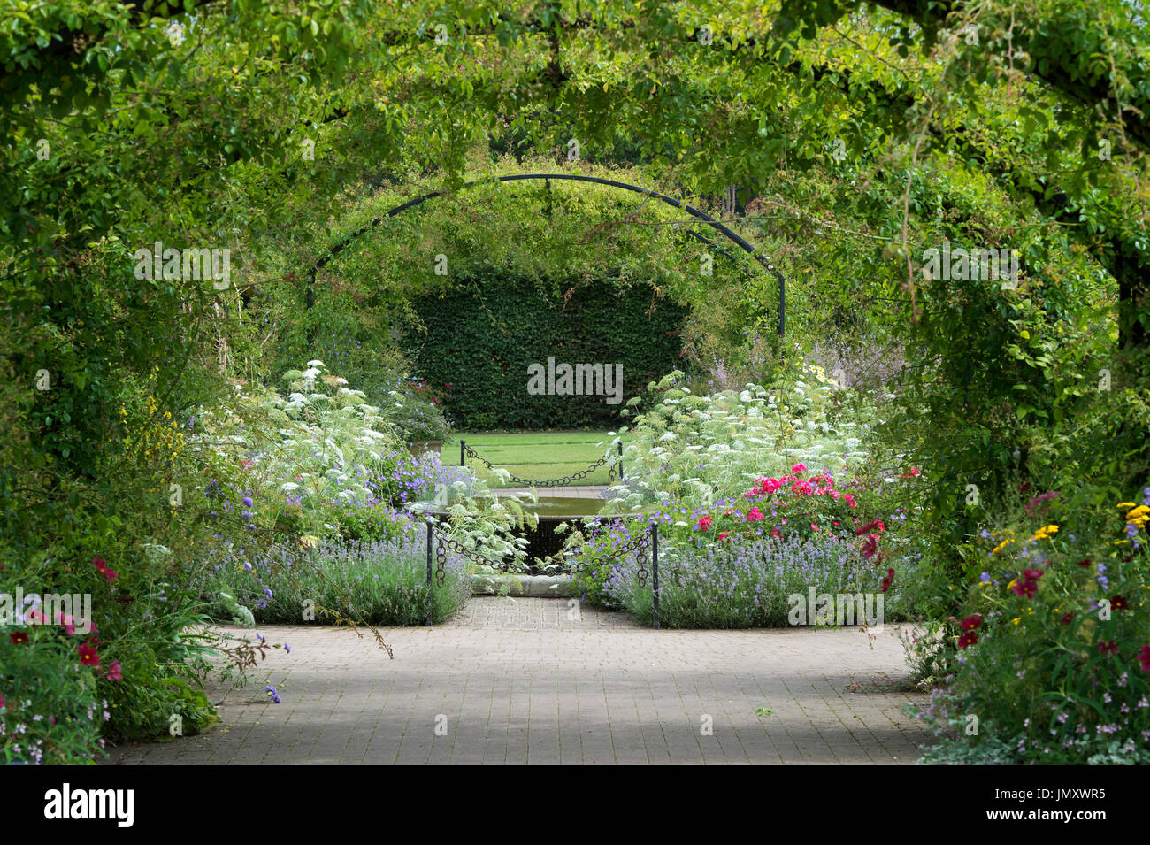Cottage garden and Water feature and archways at RHS Wisley Gardens, Surrey, UK Stock Photo