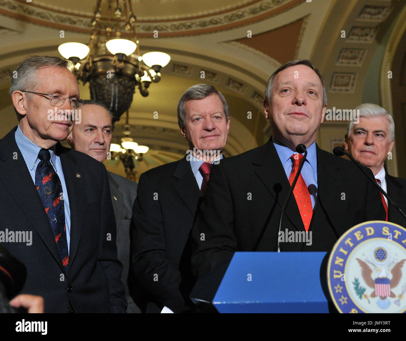 Washington, DC - December 24, 2009 -- United States Senator Dick Durbin (Democrat of Illinois) makes remarks after voting to pass H.R. 3590, regarding health care reform in the U.S. Capitol on Thursday, December 24, 2009.  The vote, which was along party lines, was 60 Democrats in favor and 39 Republicans against.  From left to right: U.S. Senate Majority Leader Harry Reid (Democrat of Nevada), U.S. Senator Chuck Schumer (Democrat of New York), U.S. Senator Max Baucus (Democrat of Montana), Senator Durbin, and U.S. Senator Christopher Dodd (Democrat of Connecticut)..Credit: Ron Sachs / CNP.(RE Stock Photo