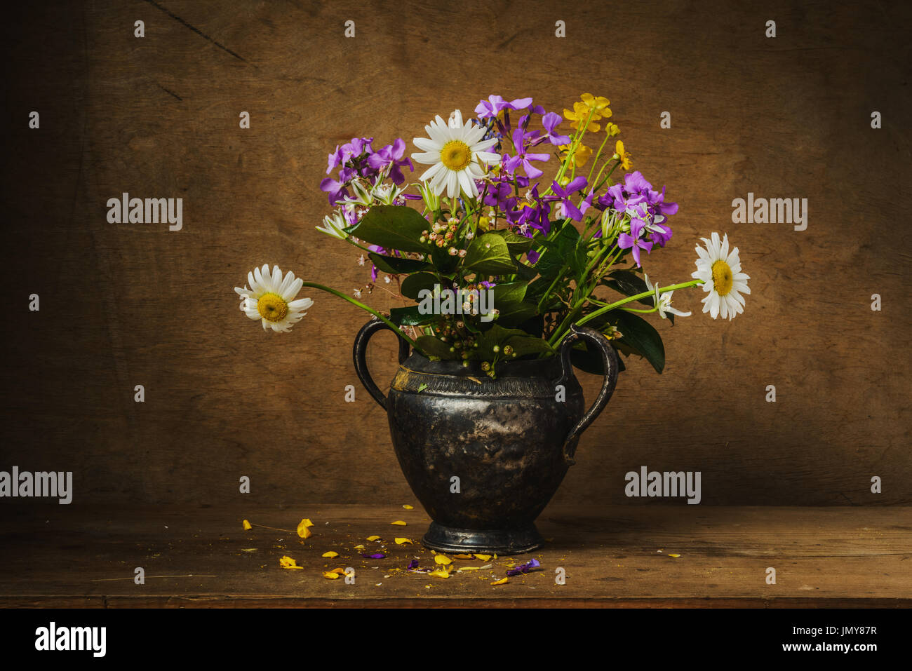 Still life- wild flowers bouquet in vintage vase metal Stock Photo - Alamy