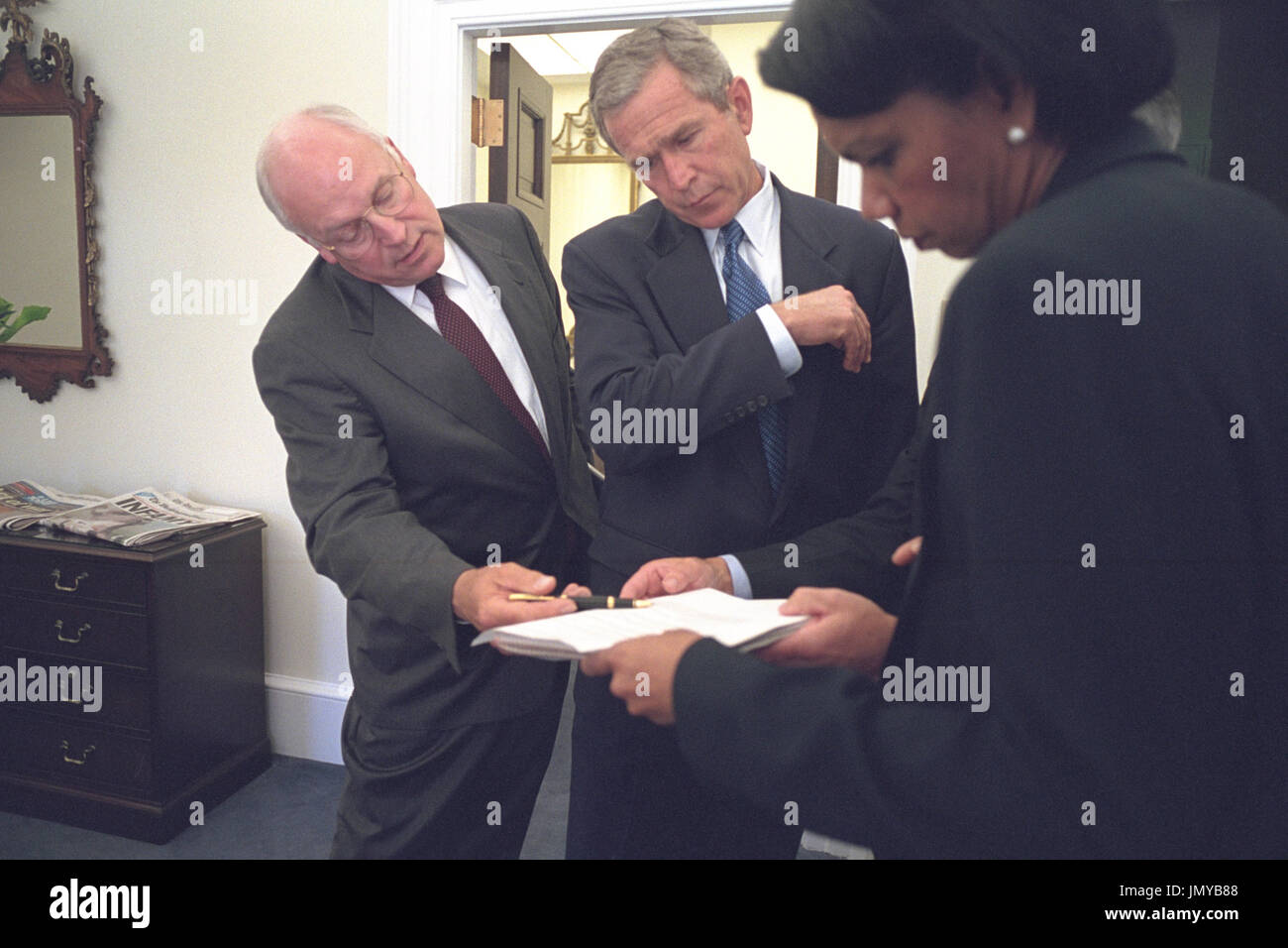United States President George W. Bush looks over a brief with U.S ...