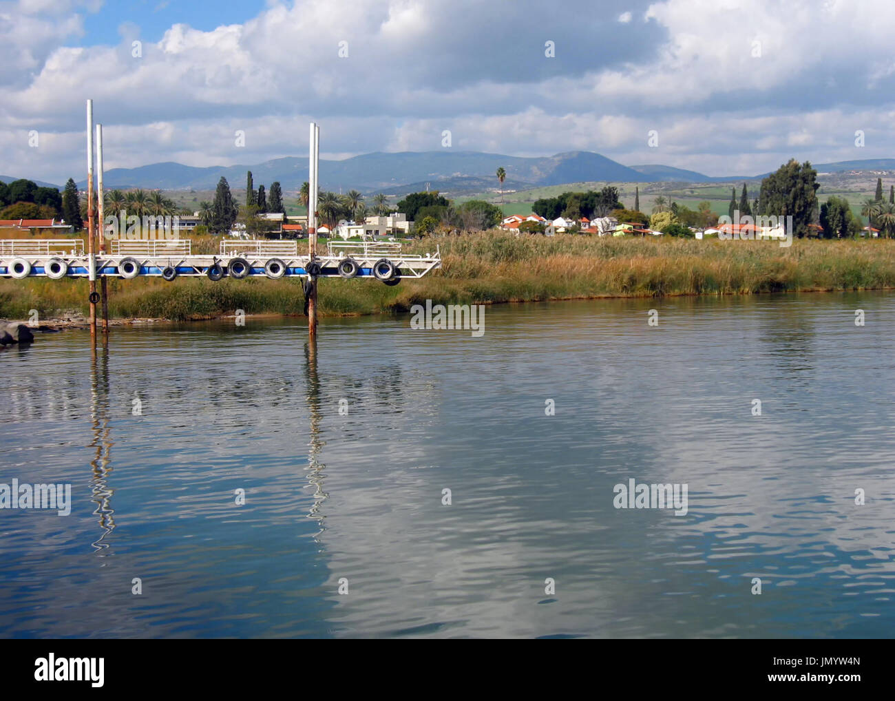 A boat pier on the Sea of Galilee in Israel shows the dramatic low water level. Stock Photo