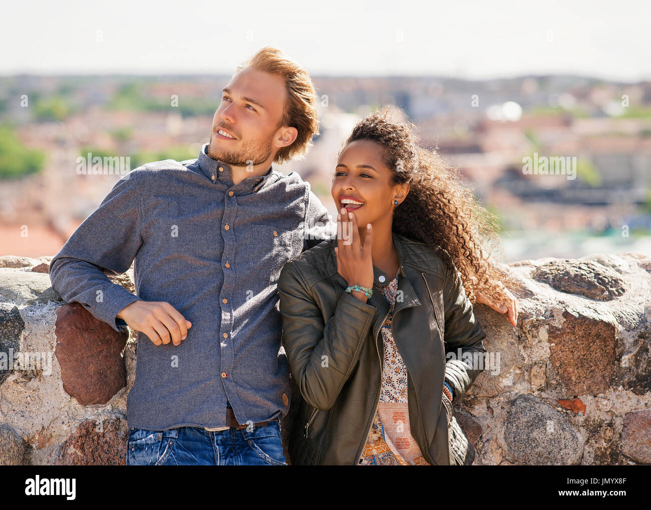 Surprised Young Mixed Race Girl With Caucasian Friend Standing And