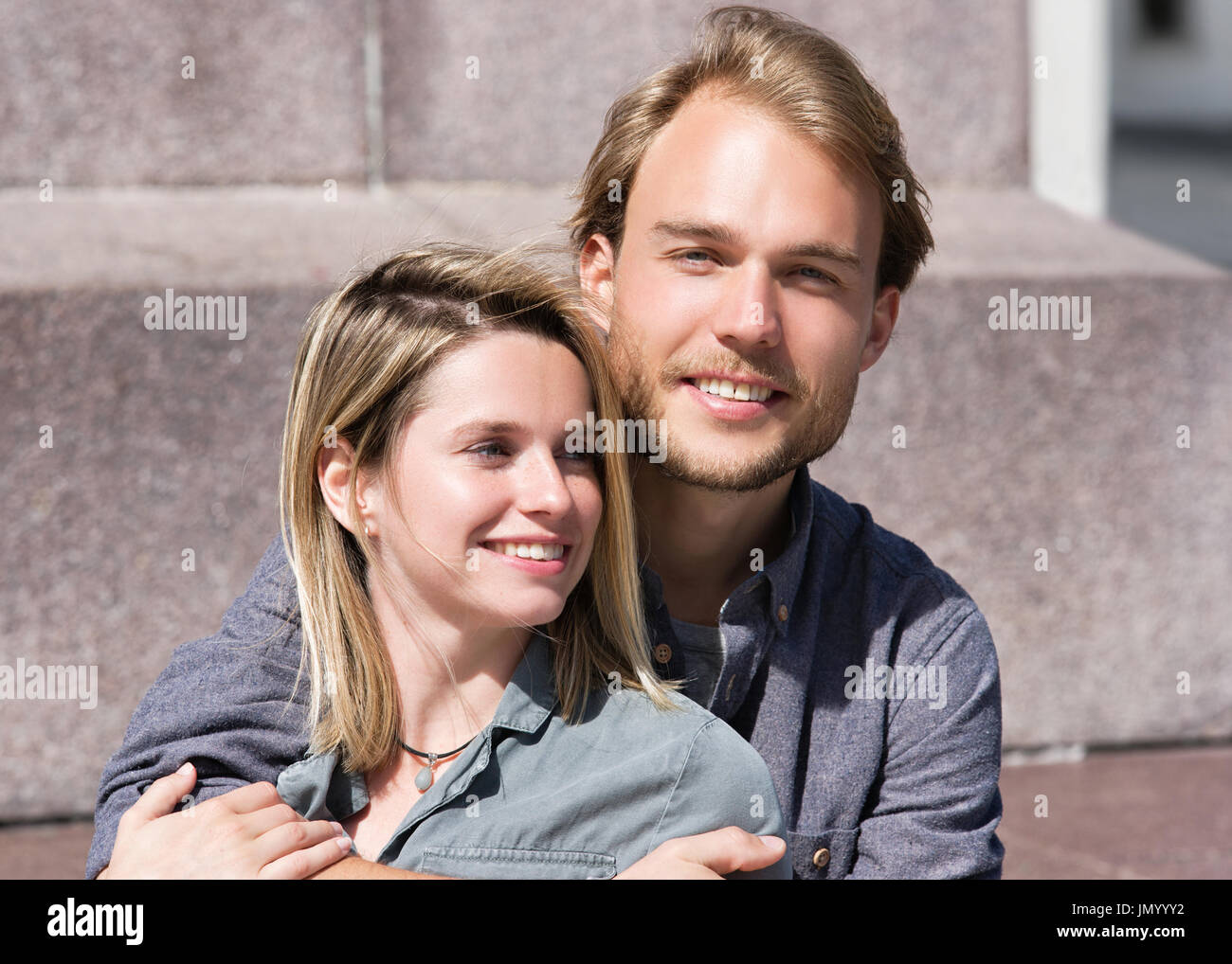 Young man embraces hi-res stock photography and images - Alamy