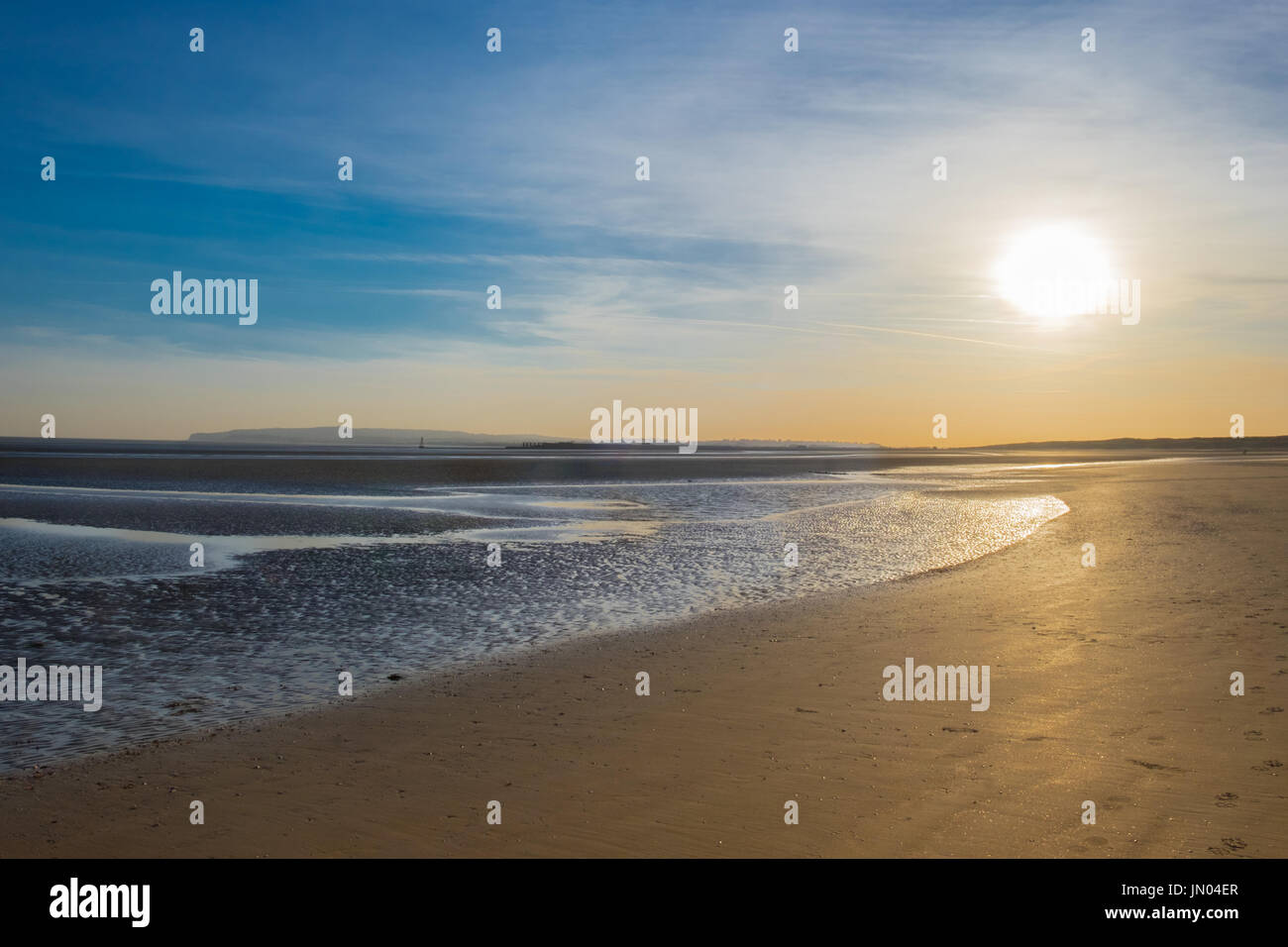 Sunset on Camber Sands Beach at low tide, East Sussex, England Stock Photo