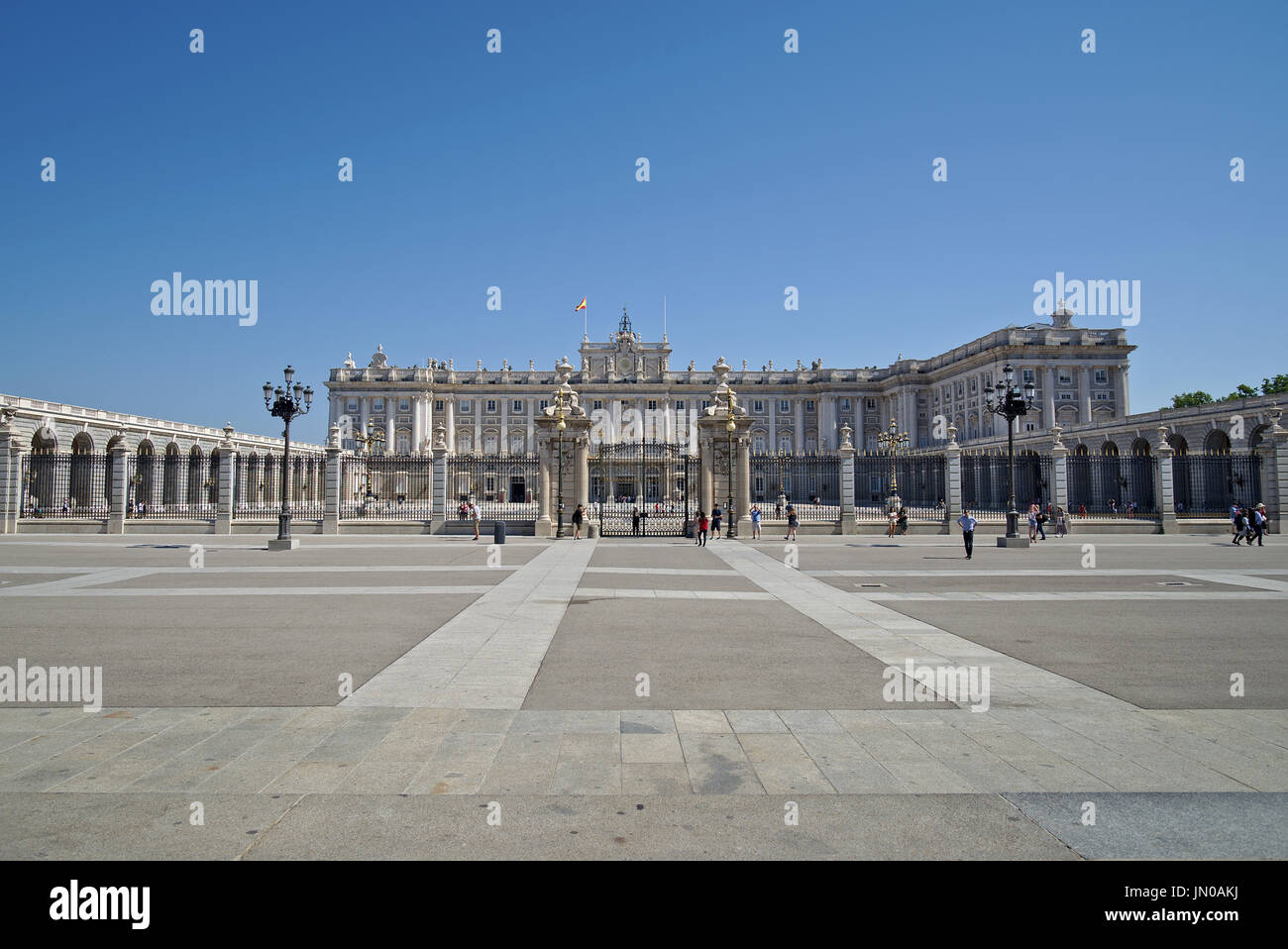 Front view of the Palacio Real (Royal Palace) in Madrid, Spain, in a very sunny day with absolutely no clouds. Stock Photo