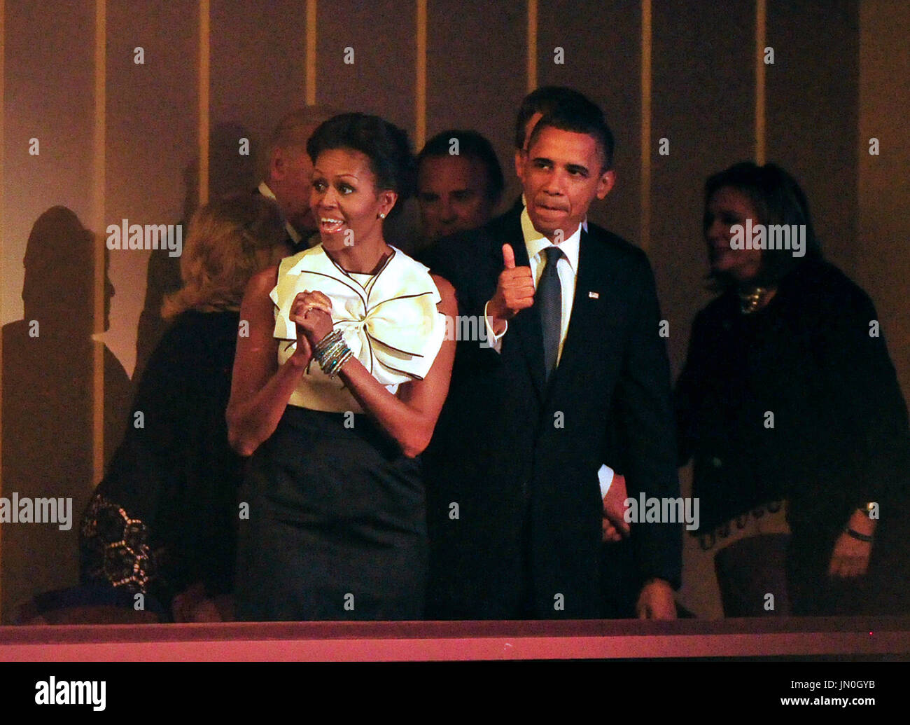 United States President Barack Obama gives a thumbs-up as he and first ...