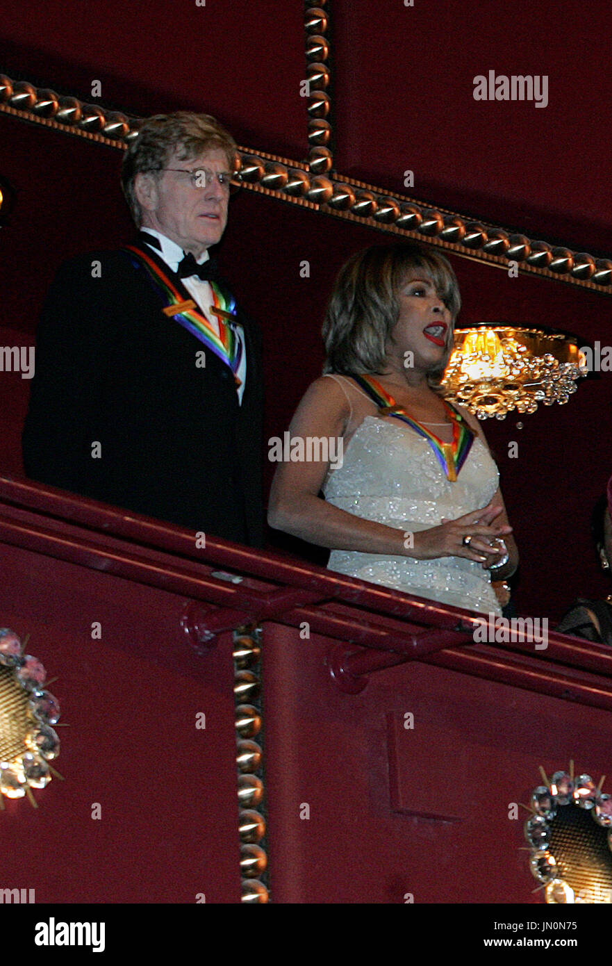 Actor Robert Redford, left, and singer Tina Turner attend the Kennedy