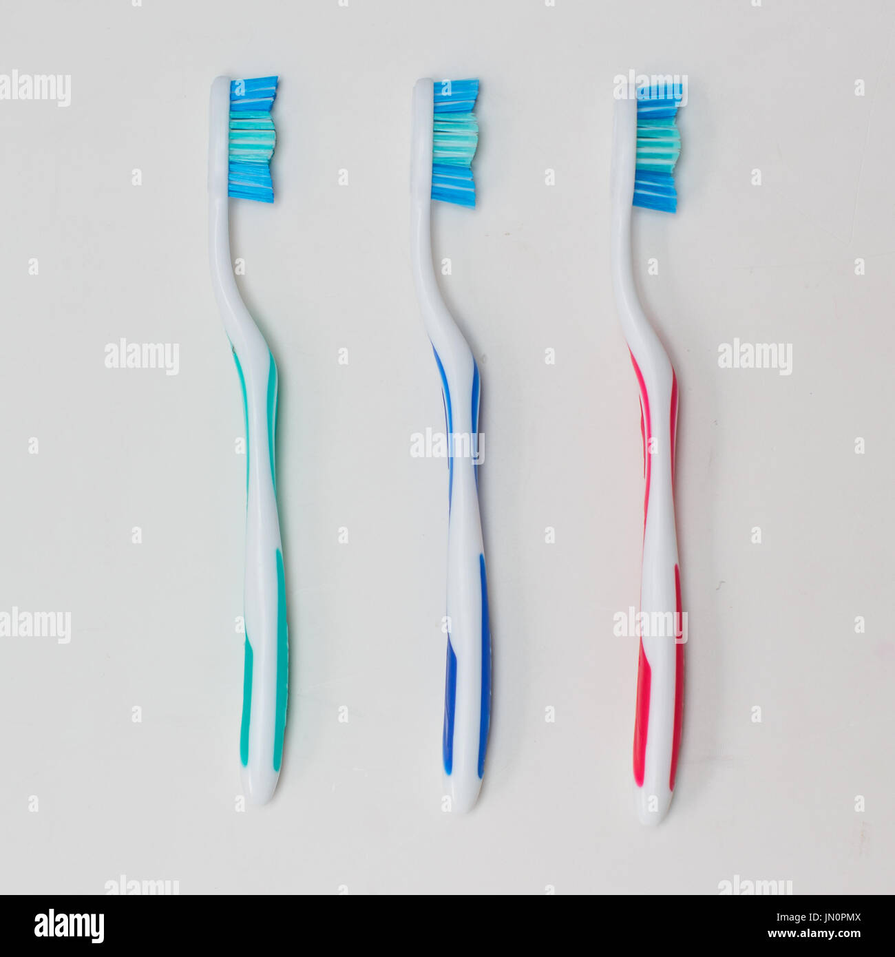 3 toothbrushes on clean background Stock Photo