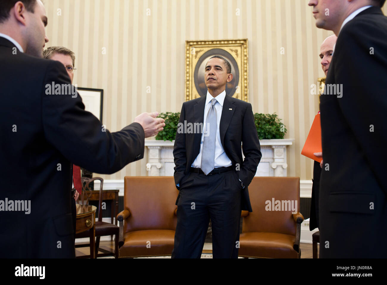 United States President Barack Obama talks with senior advisors ...