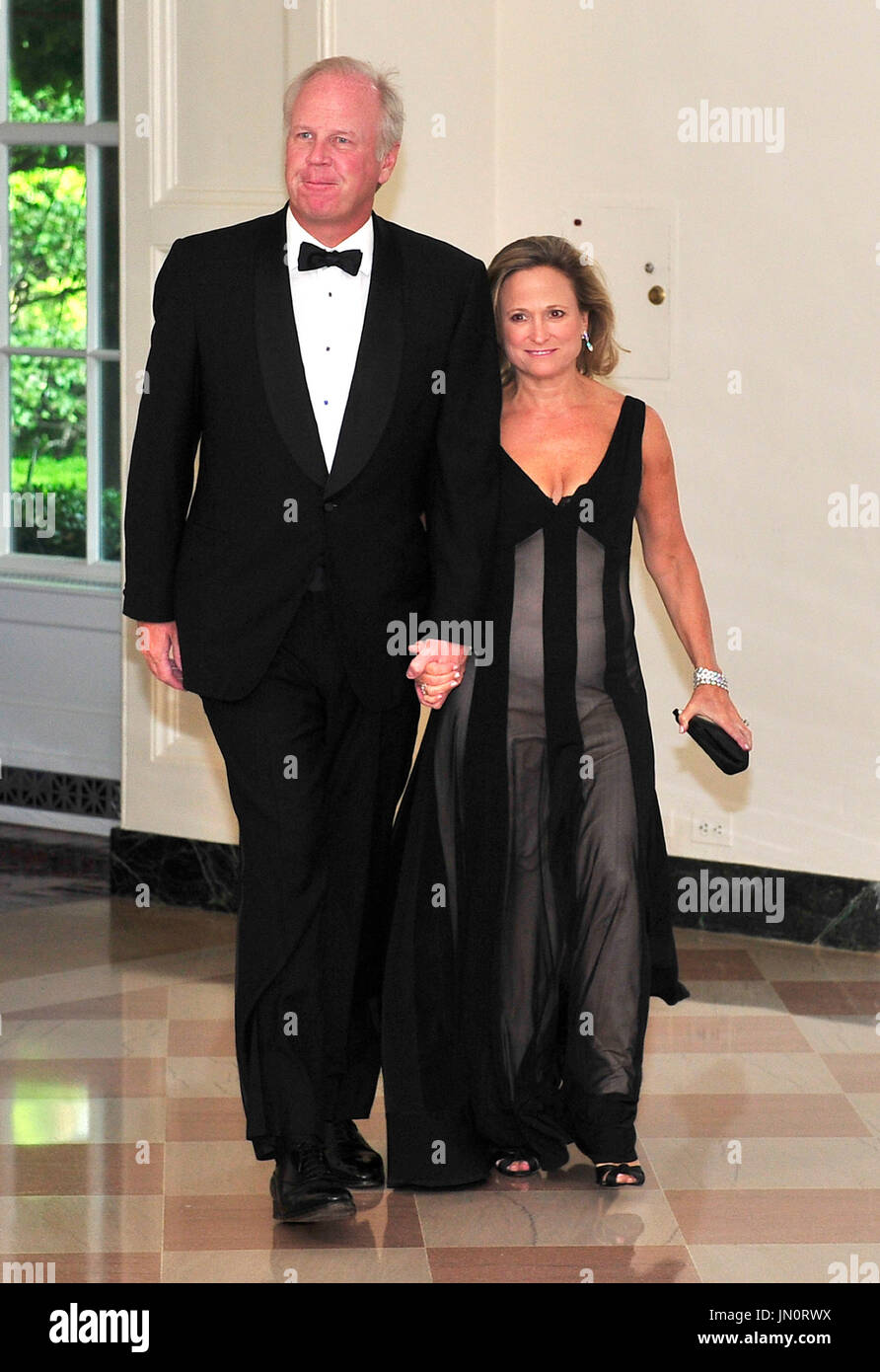 John Cooney of Chicago, Illinois, and his wife, Barbara, arrive for a State Dinner in honor of