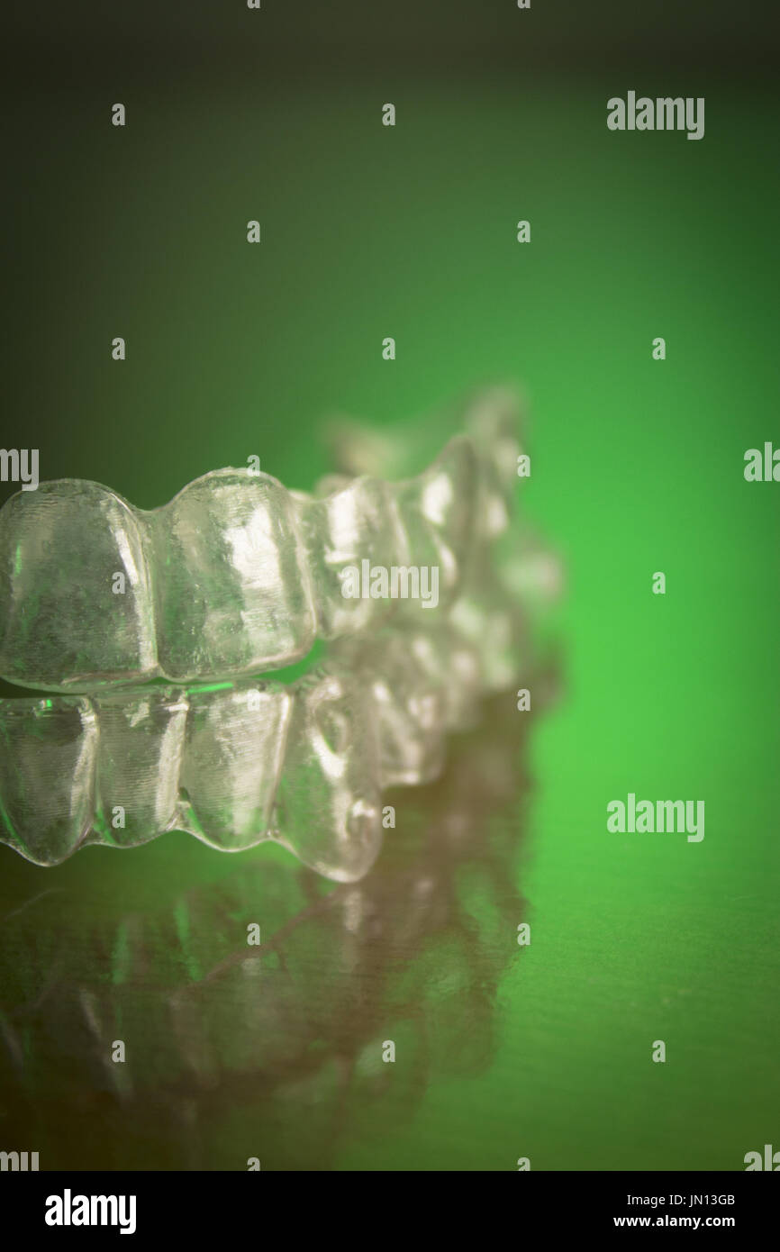 Plastic dental orthodontics on colored background. No people Stock