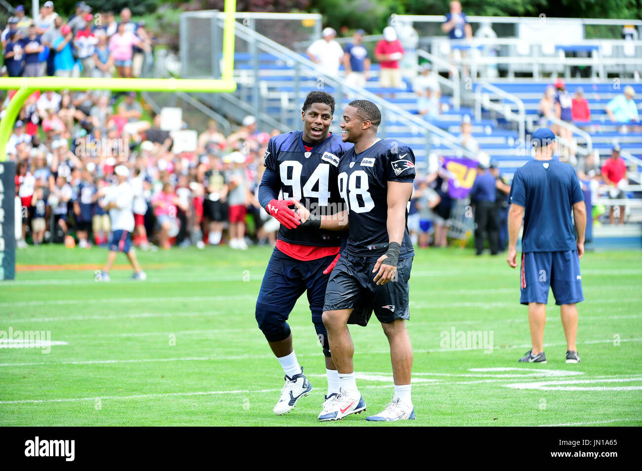Foxborough, Massachusetts, USA. 28th July, 2017. New England Patriots defensive end Kony Ealy (94) and defensive lineman Trey Flowers (98) shake hands at at the New England Patriots training camp held at Gillette Stadium, in Foxborough, Massachusetts. Eric Canha/CSM/Alamy Live News Stock Photo