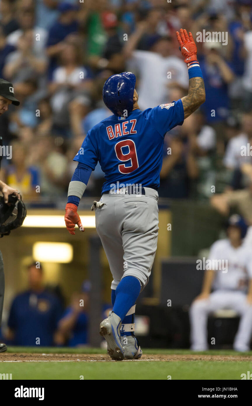 Milwaukee, WI, USA. 28th July, 2017. Chicago Cubs second baseman Javier Baez  #9 hits a solo home run in the 8th inning of the Major League Baseball game  between the Milwaukee Brewers