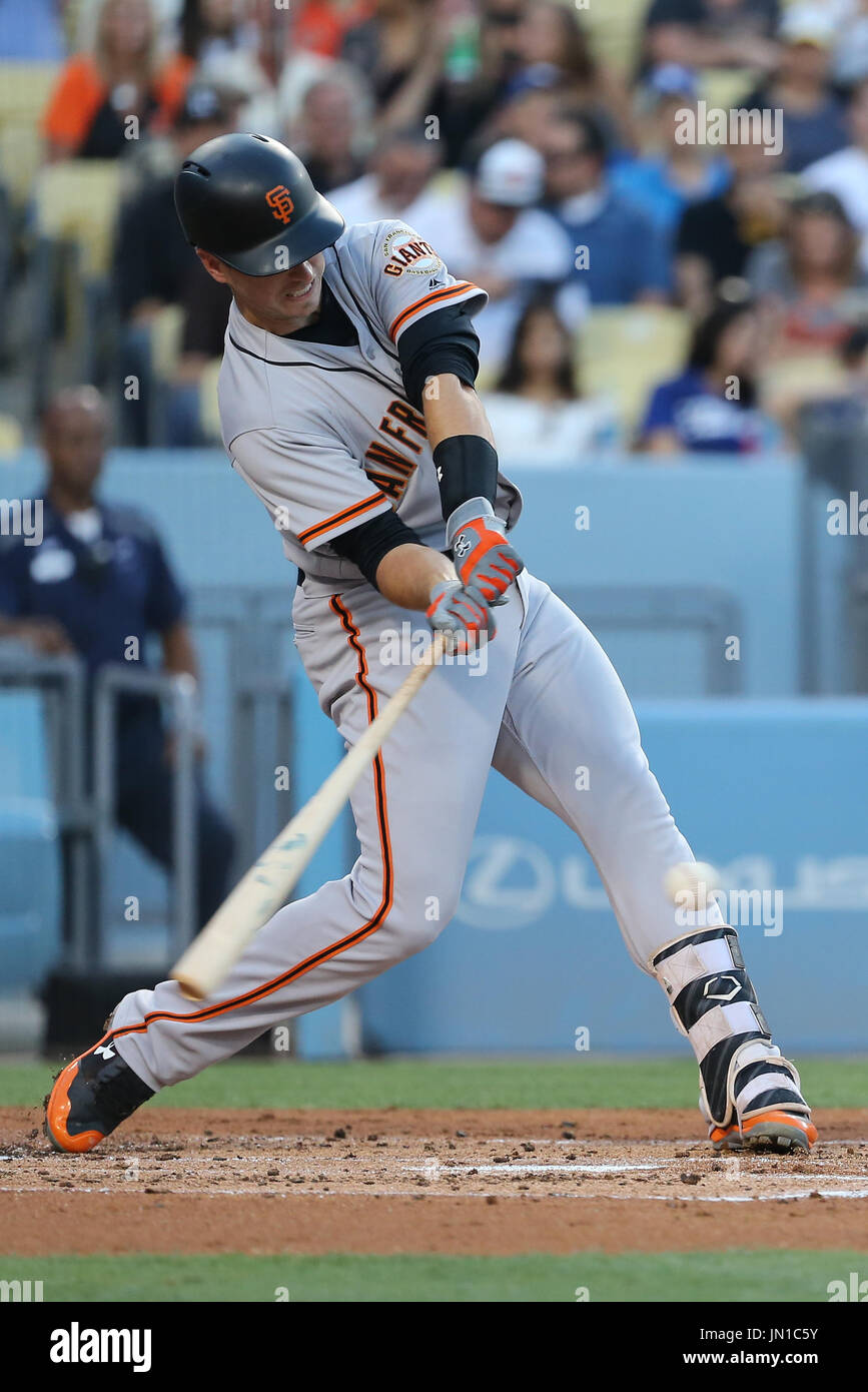 Los Angeles, CA, USA. 28th July, 2017. San Francisco Giants catcher Buster Posey (28) makes contact at the plate in the game between the San Francisco Giants and the Los Angeles Dodgers, Dodger Stadium in Los Angeles, CA. Photographer: Peter Joneleit. Credit: csm/Alamy Live News Stock Photo