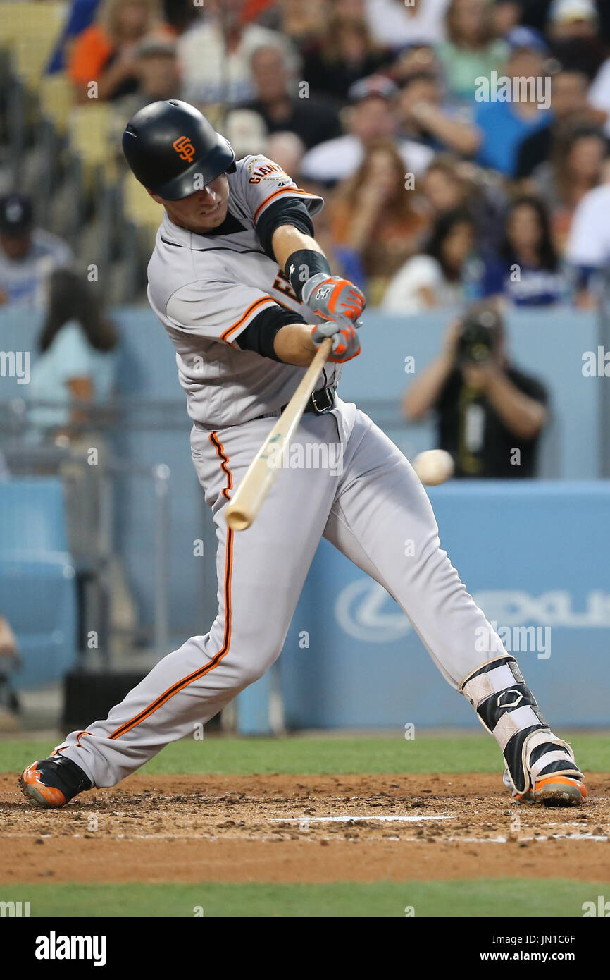 Los Angeles, CA, USA. 28th July, 2017. San Francisco Giants catcher Buster Posey (28) connects at the plate for a single in the game between the San Francisco Giants and the Los Angeles Dodgers, Dodger Stadium in Los Angeles, CA. Photographer: Peter Joneleit. Credit: csm/Alamy Live News Stock Photo
